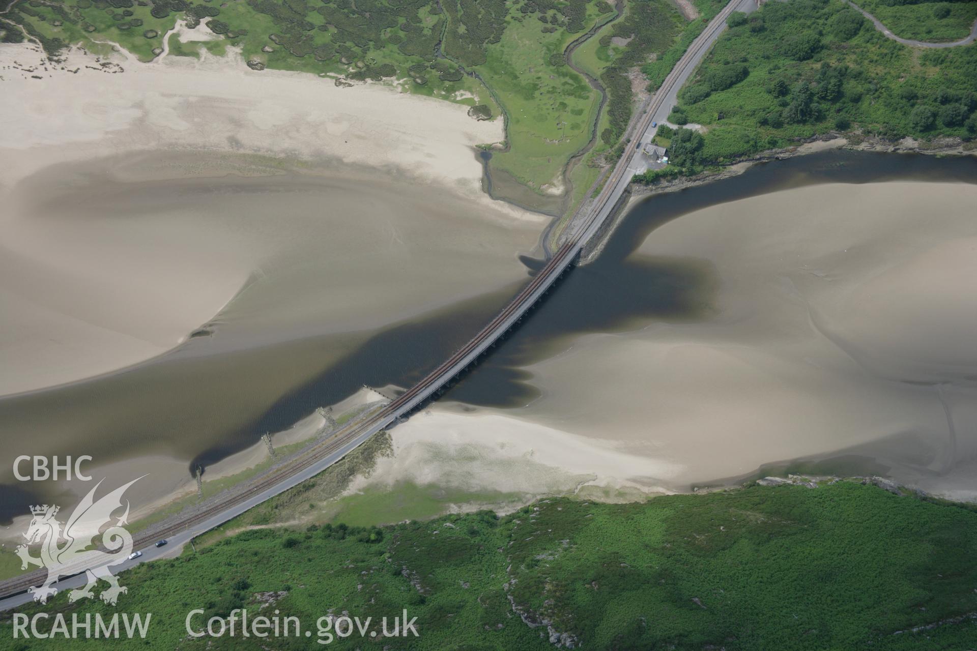 RCAHMW colour oblique aerial photograph of Traeth Bach Railway Viaduct, Llandecwyn. Taken on 04 July 2006 by Toby Driver.