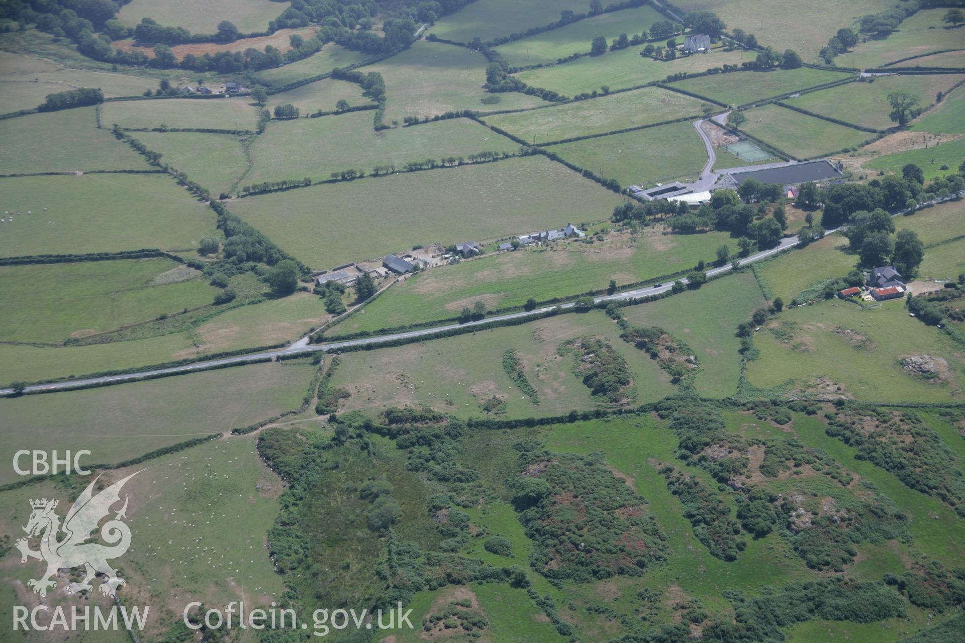 RCAHMW colour oblique aerial photograph of Clogwyn Bach, Settlement Remains from the north-west. Taken on 03 August 2006 by Toby Driver.