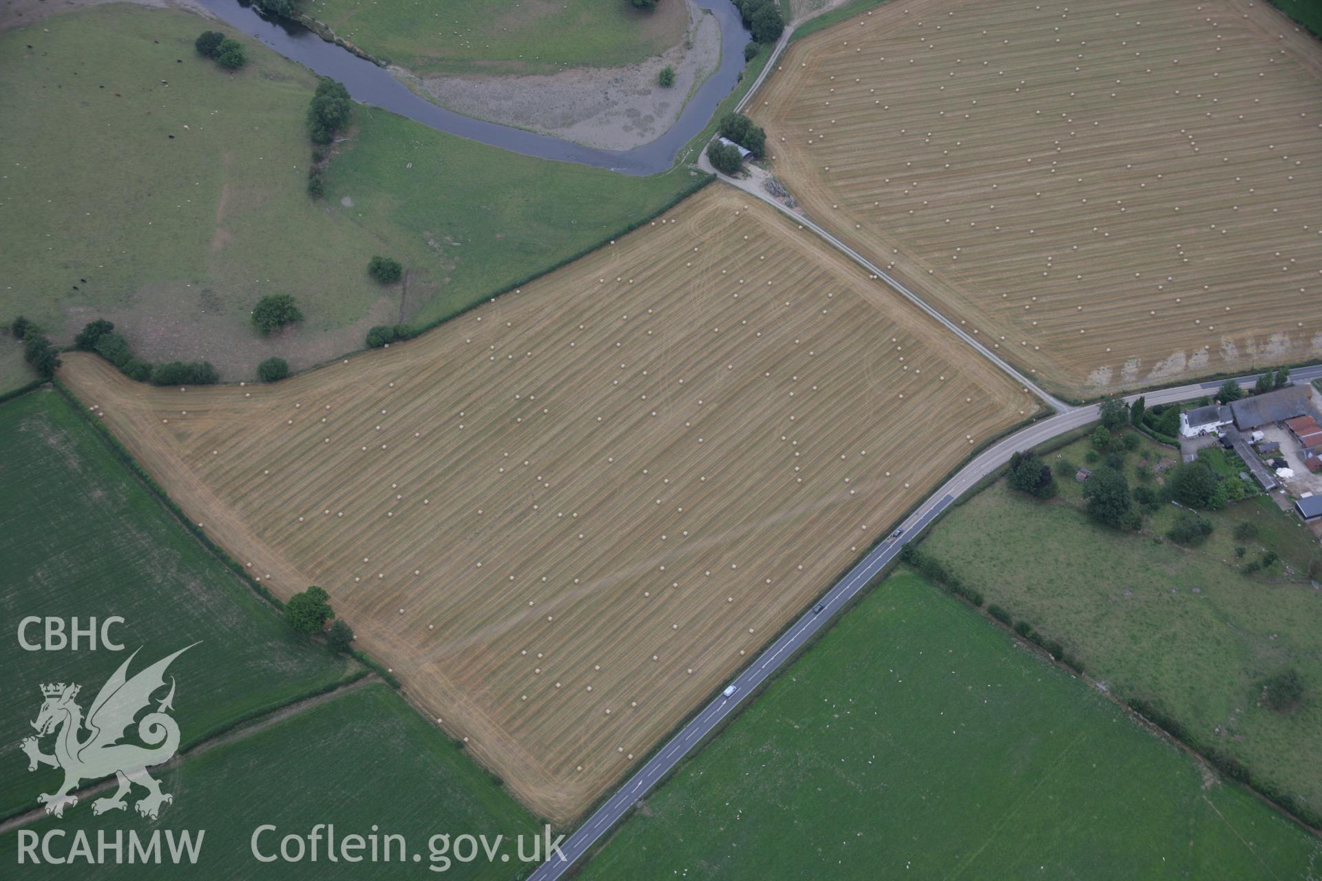 RCAHMW colour oblique aerial photograph of a section of Roman Road at Maes-Mawr Hall. Taken on 14 August 2006 by Toby Driver.