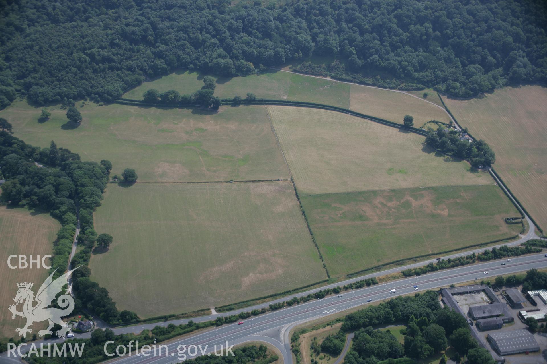 RCAHMW colour oblique aerial photograph of a section of the Caerhun to Caernarfon Roman Road Segment at Madryn. Taken on 25 July 2006 by Toby Driver.