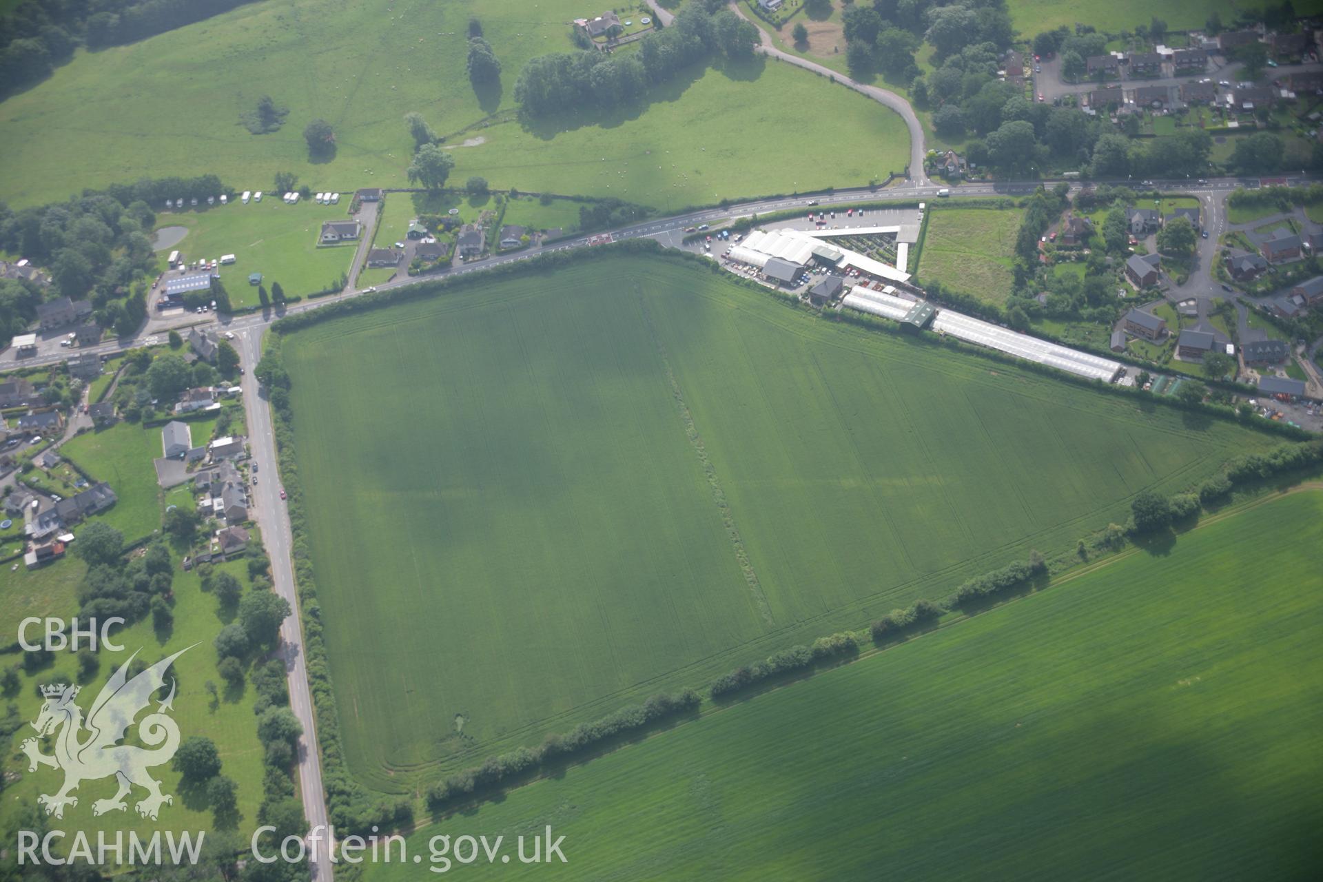 RCAHMW colour oblique photograph of Gwernyfed, Roman road cropmark. Taken by Toby Driver on 29/06/2006.