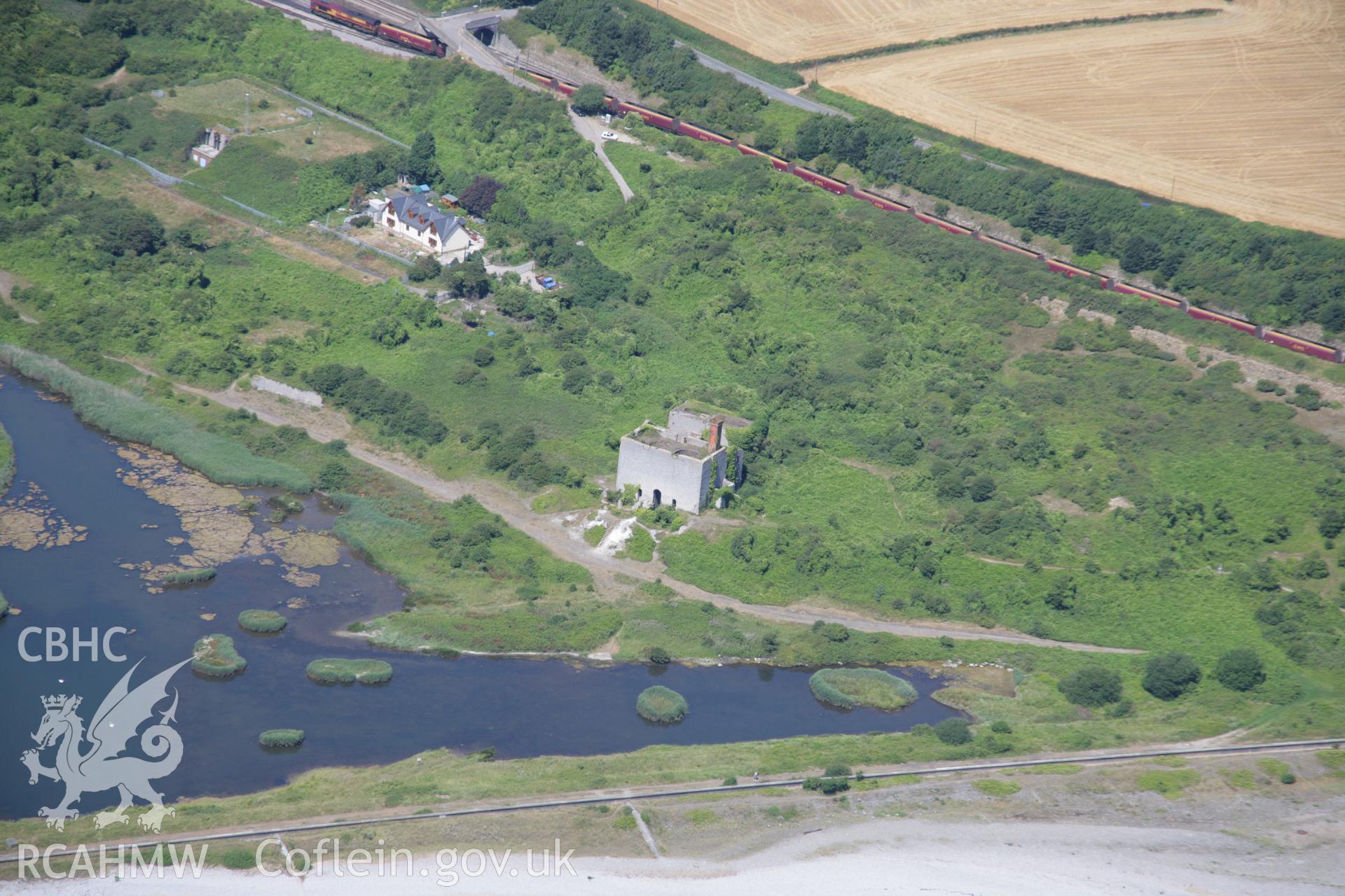 RCAHMW colour oblique aerial photograph of Aberthaw Old Cement and Limeworks. Taken on 24 July 2006 by Toby Driver.