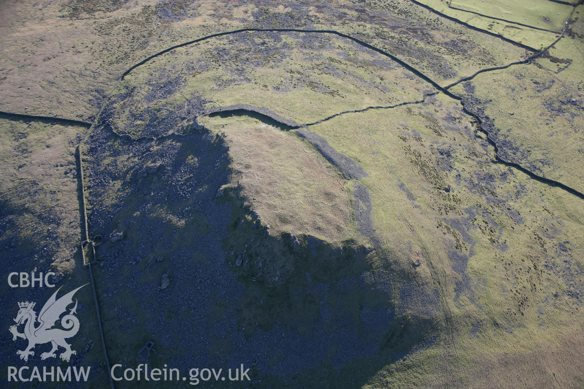 RCAHMW colour oblique aerial photograph of Pen-y-Gaer Hillfort, viewed from the north. Taken on 09 February 2006 by Toby Driver.