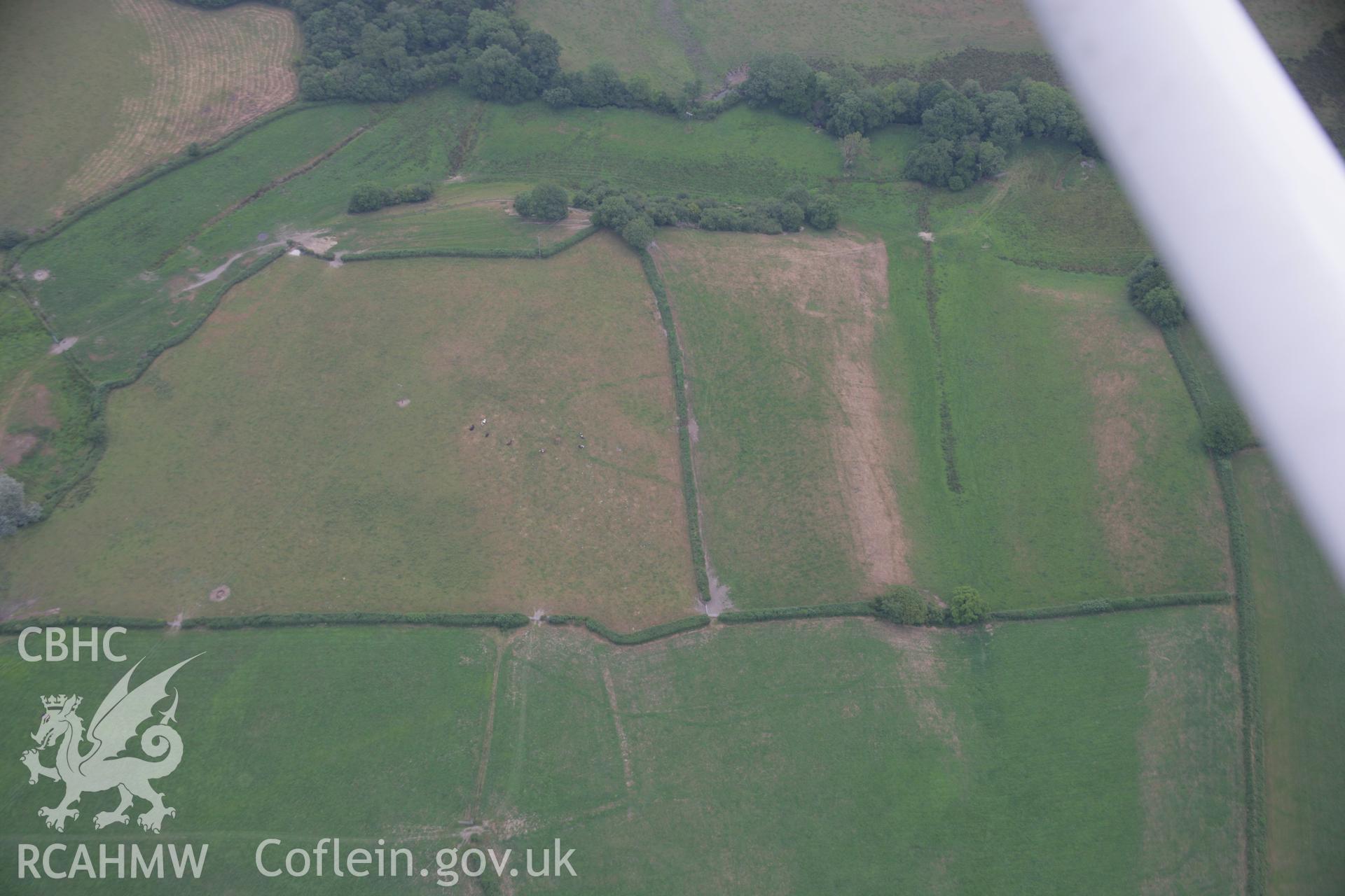 RCAHMW colour oblique aerial photograph of a cropmark enclosure south of Blaen-Lliwe. Taken on 21 July 2006 by Toby Driver.