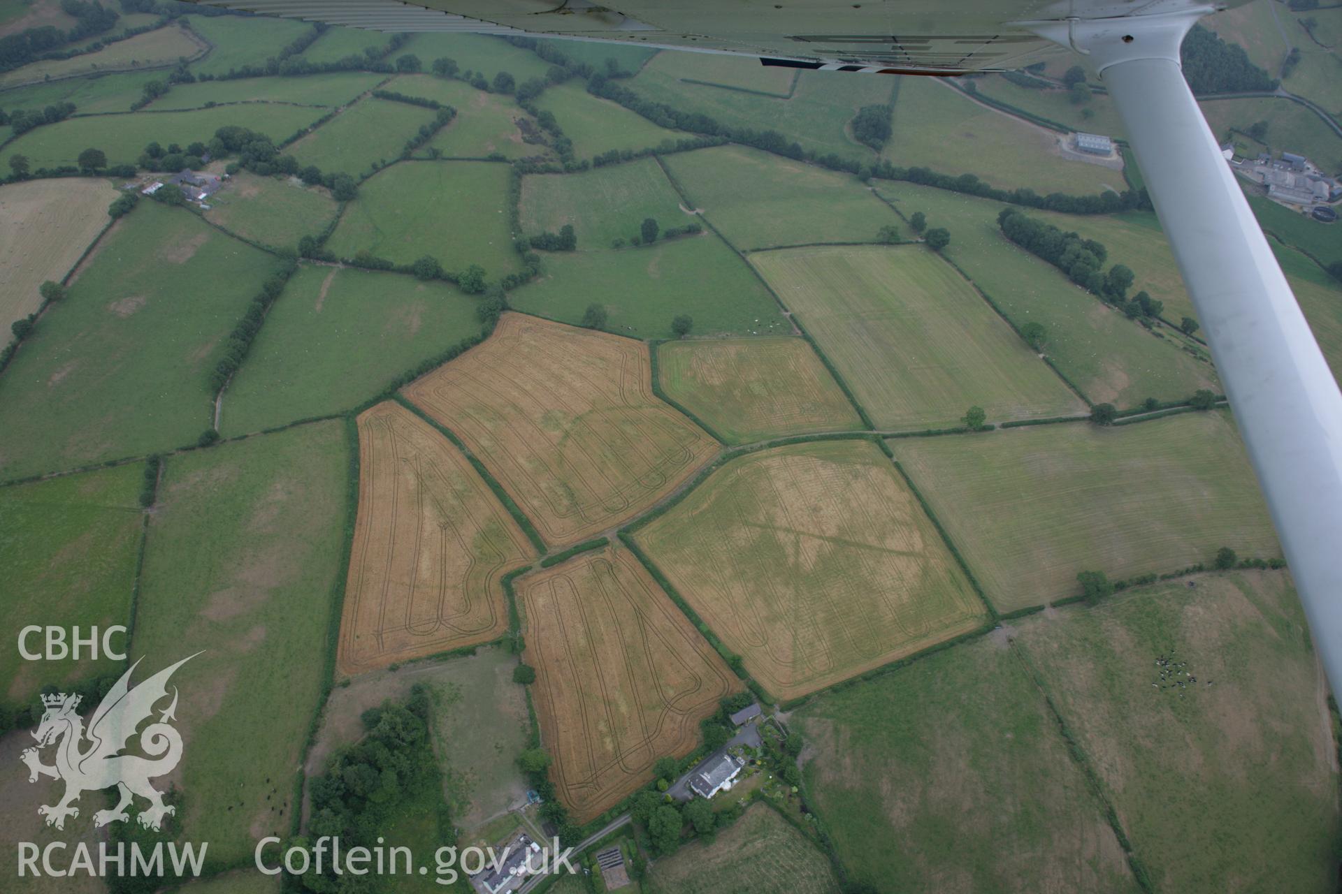 RCAHMW colour oblique aerial photograph of St Sulien's Church Enclosure. Taken on 21 July 2006 by Toby Driver.