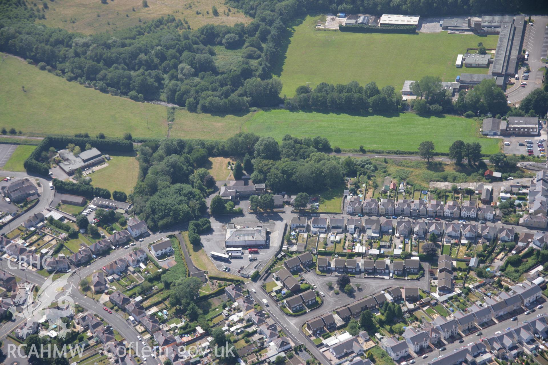 RCAHMW colour oblique aerial photograph of Tir-y-Dail Motte and Bailey, Ammanford, Rhydaman. Taken on 24 July 2006 by Toby Driver.