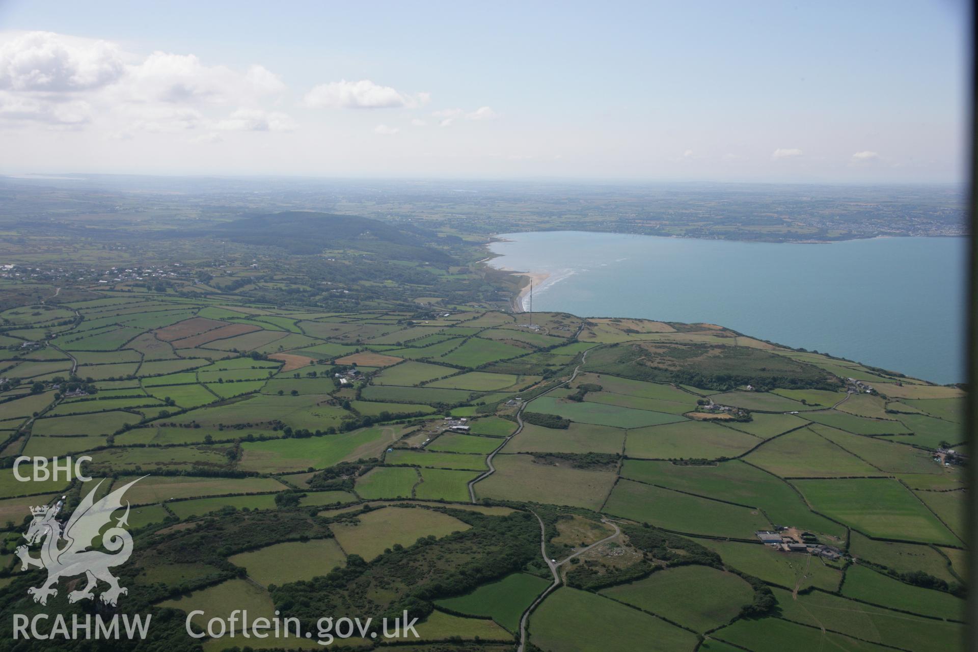 RCAHMW colour oblique aerial photograph of the landscape around Bwrdd Arthur. Taken on 14 August 2006 by Toby Driver.