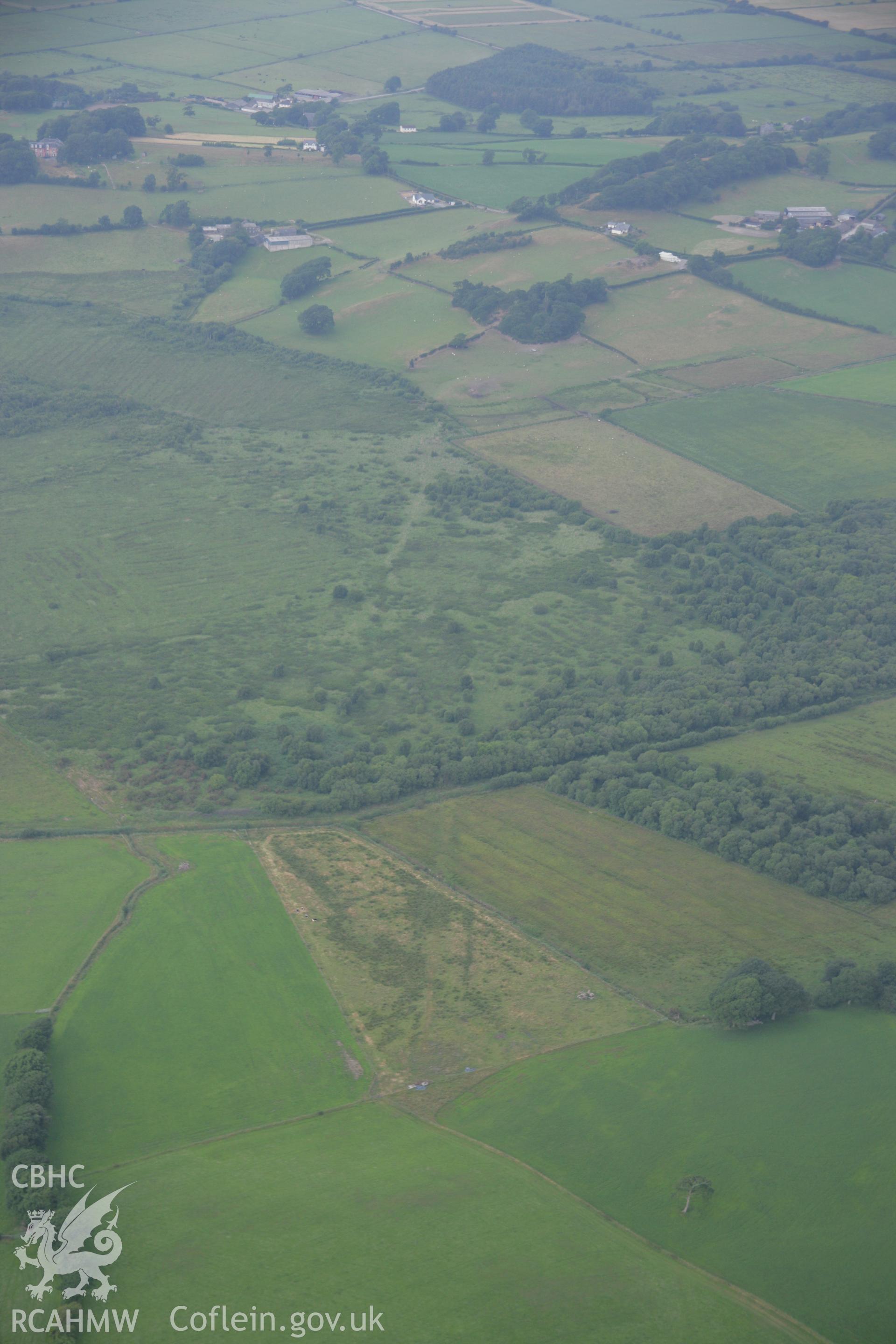 RCAHMW colour oblique aerial photograph of Llangynfelin Timber Trackway. Taken on 04 July 2006 by Toby Driver.