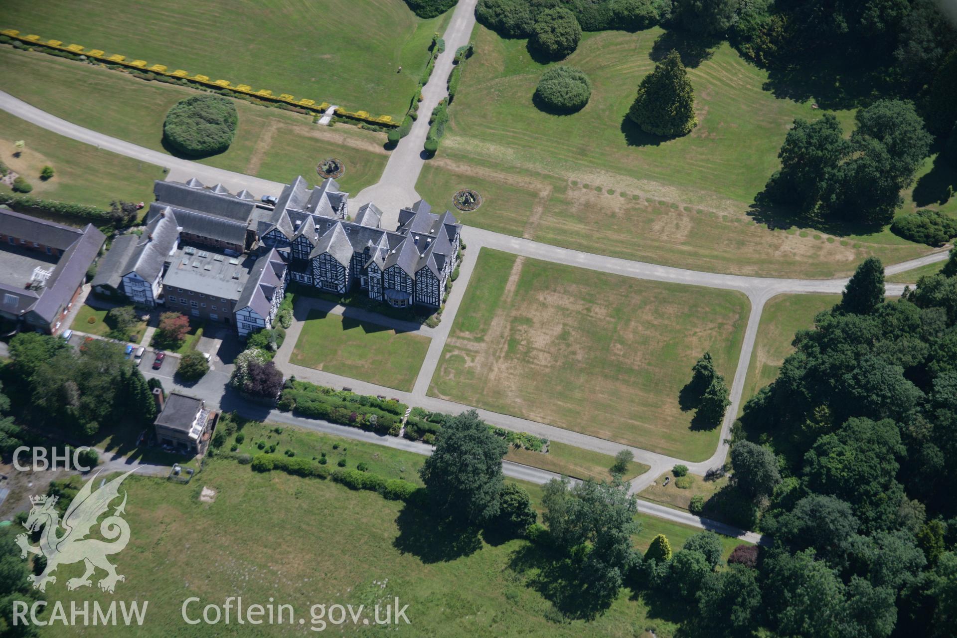 RCAHMW colour oblique aerial photograph of Gregynog Hall Garden, Tregynon, showing parchmarks. Taken on 17 July 2006 by Toby Driver.