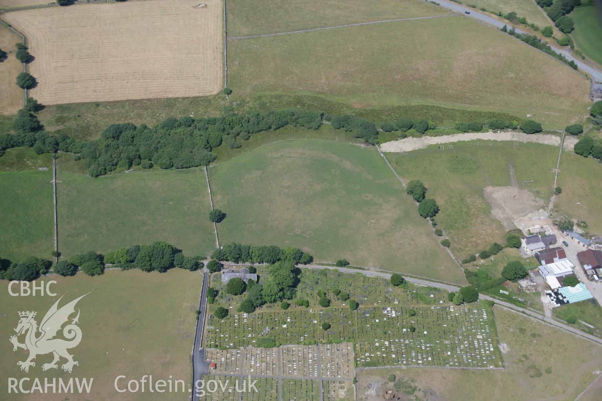 RCAHMW colour oblique aerial photograph of St Michaels Church showing nearby parchmarks. Taken on 18 July 2006 by Toby Driver.