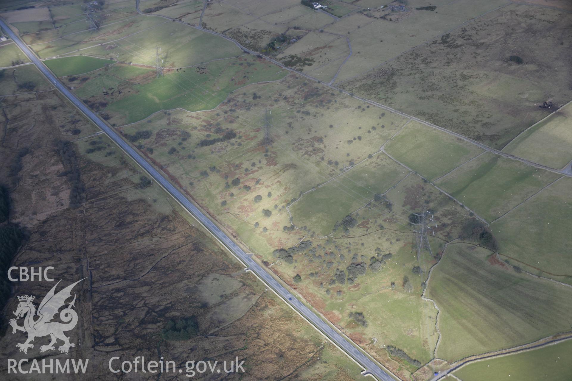 RCAHMW colour oblique aerial photograph of Caerau Settlements, viewed from the south-west. Taken on 09 February 2006 by Toby Driver