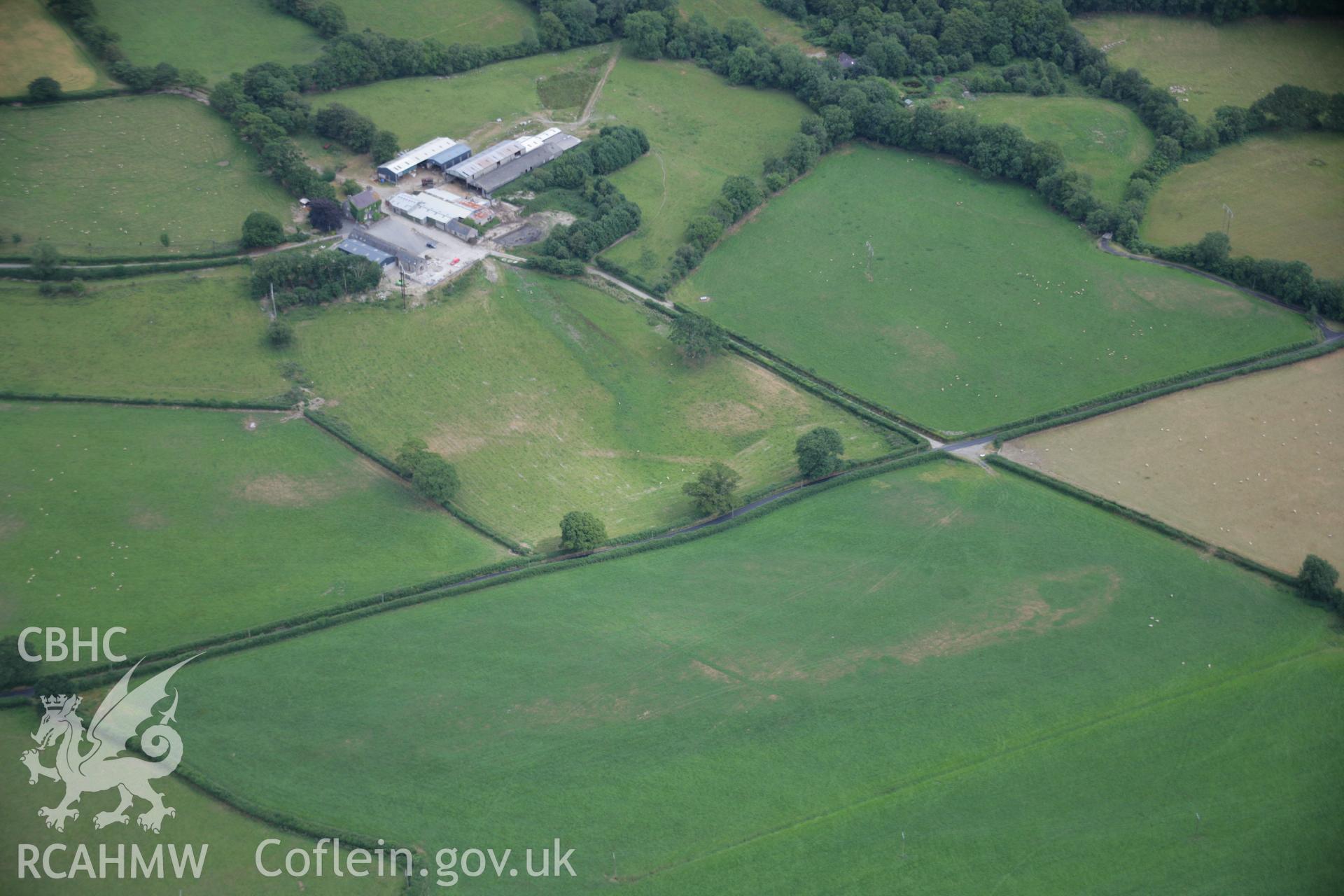 RCAHMW colour oblique aerial photograph of the Roman road between Llanio and Carmarthen at Pentre, with the road showing as a parchmark. Taken on 27 July 2006 by Toby Driver.