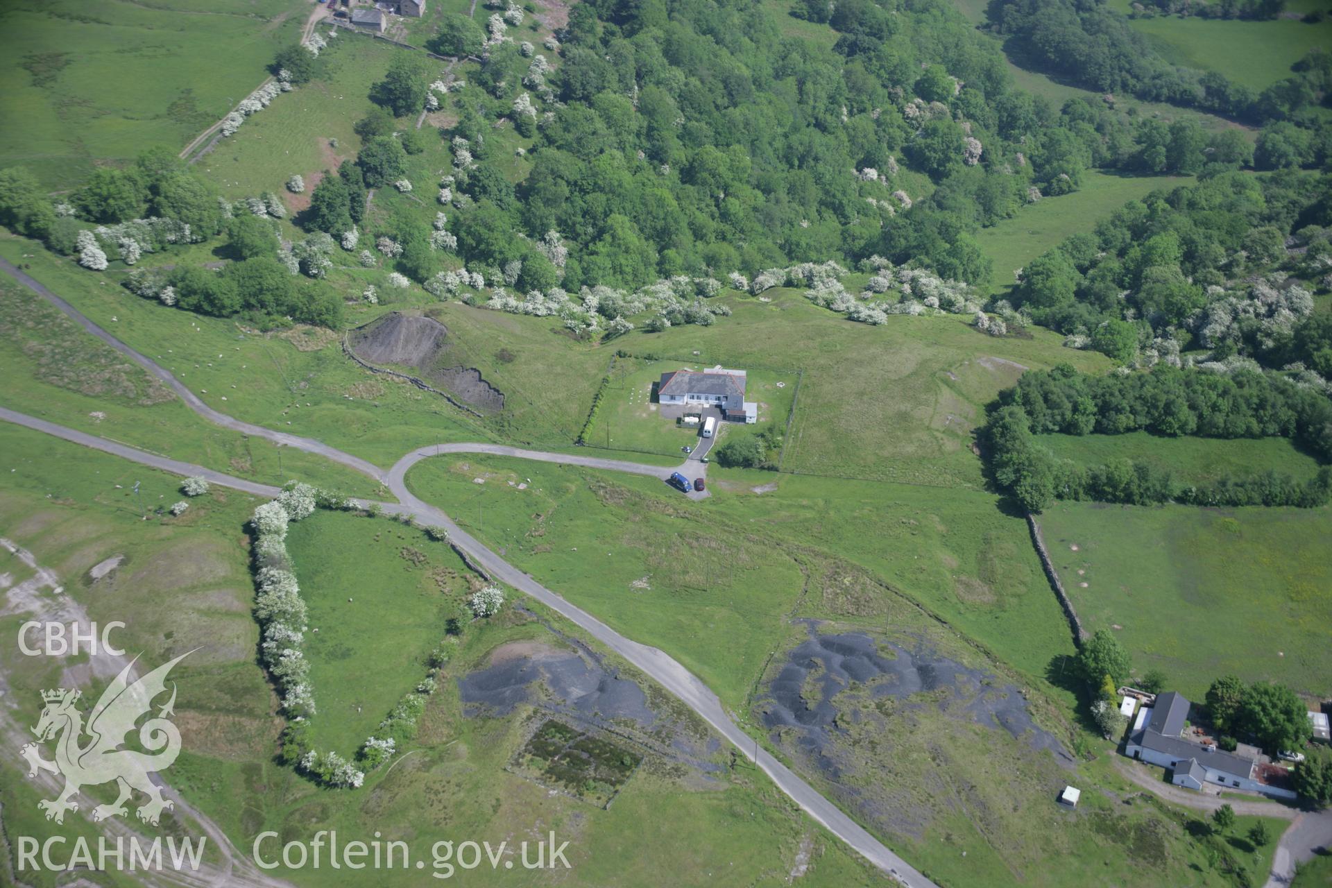 RCAHMW colour oblique aerial photograph of the north-east portal of the Pwll Du Tunnel on Hill's Tramroad, from the south-west. Taken on 09 June 2006 by Toby Driver.