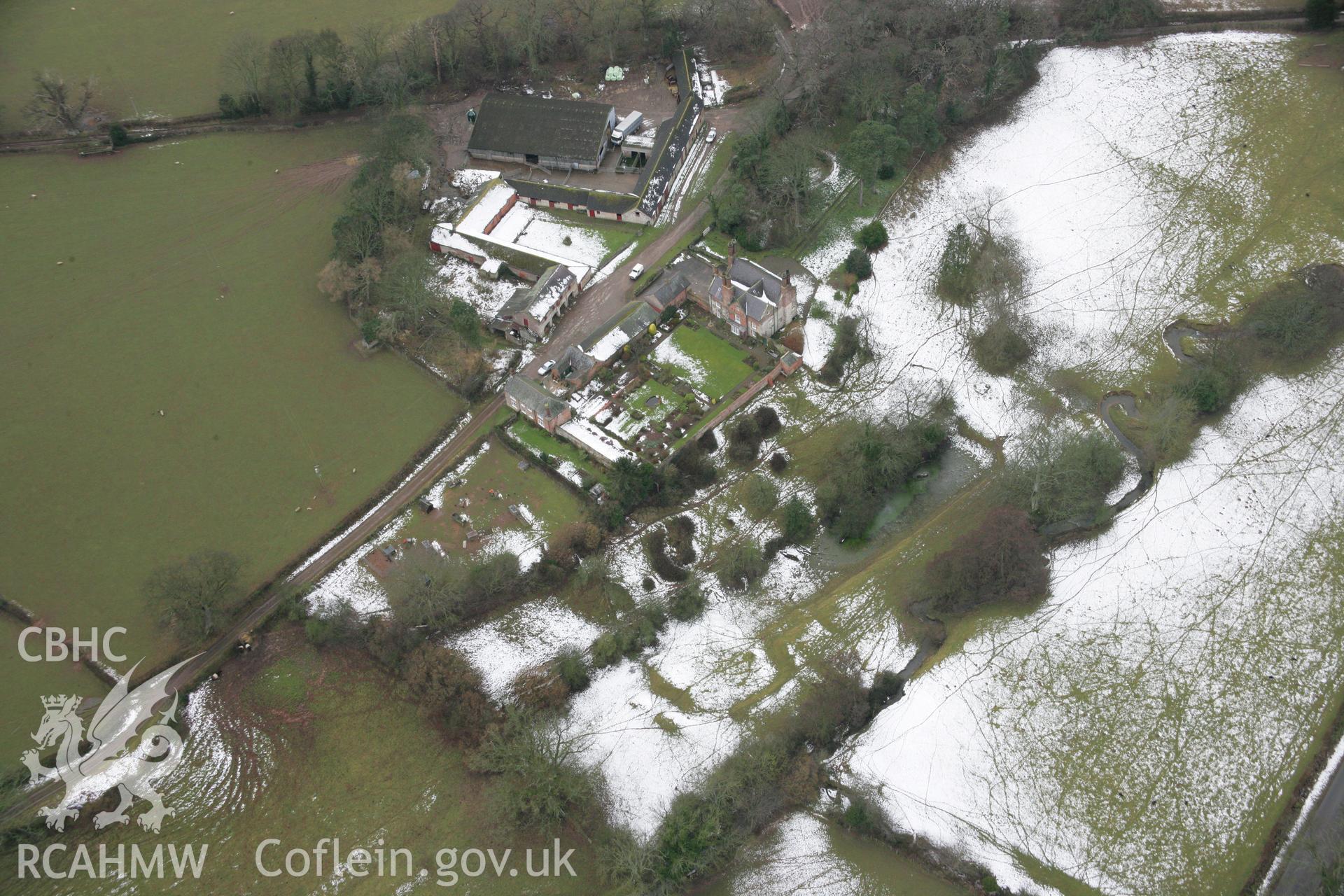 RCAHMW colour oblique aerial photograph of Garthgynan Garden, Llanfair Dyffryn Clwyd, under melting snow from the east. Taken on 06 March 2006 by Toby Driver.