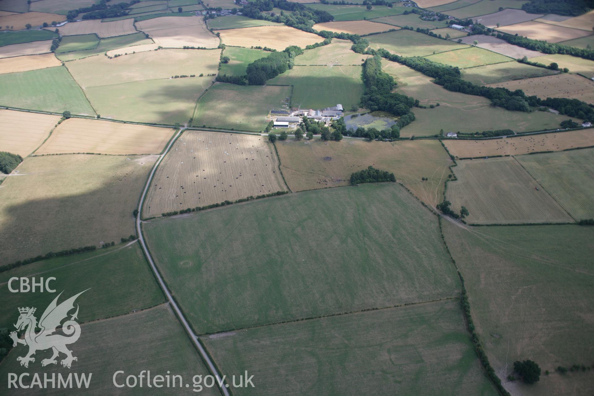 RCAHMW colour oblique aerial photograph of Hindwell Pallisaded Enclosure and Roman Camp. Taken on 27 July 2006 by Toby Driver.