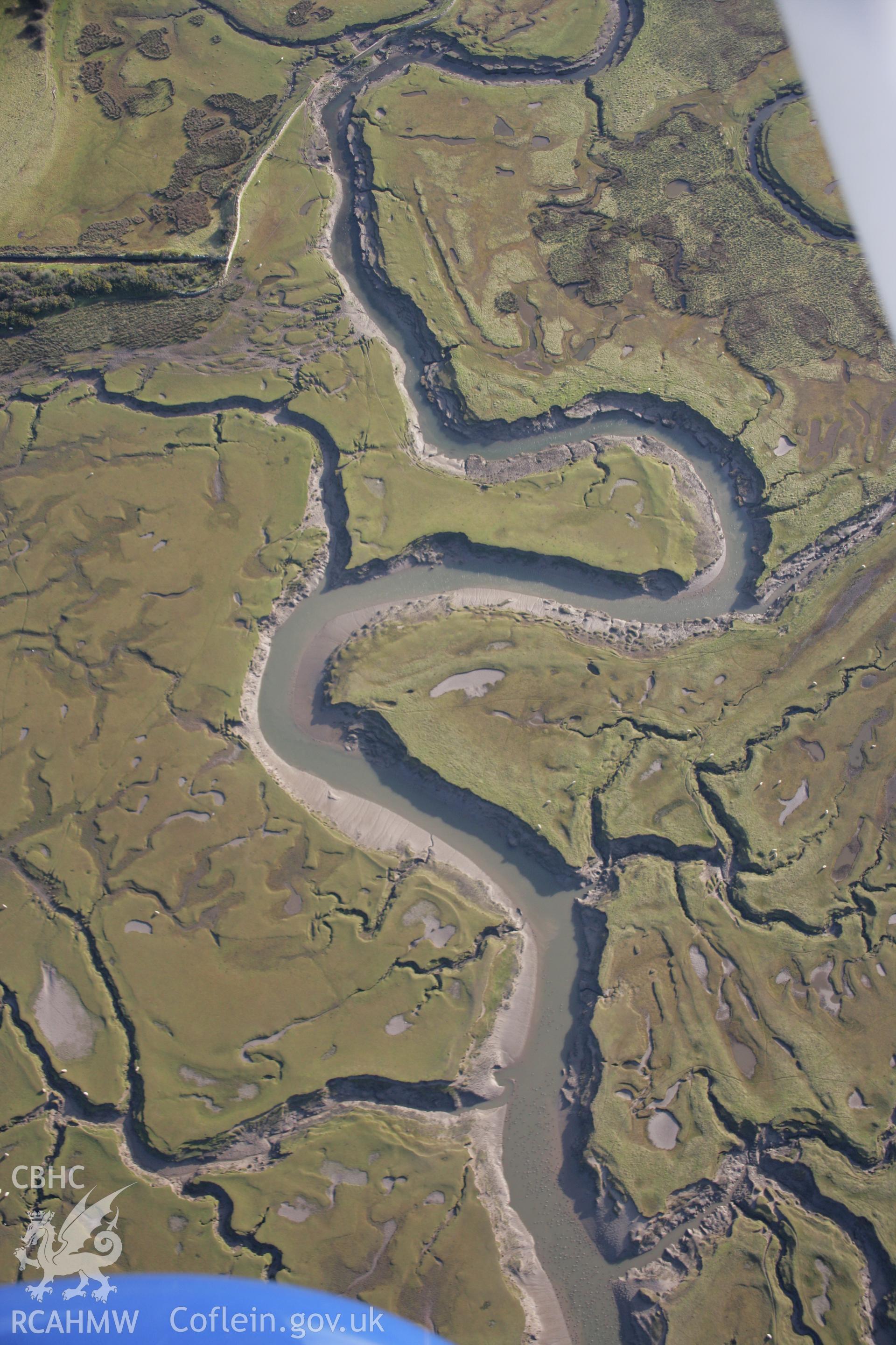 RCAHMW colour oblique aerial photograph of North Hill Tor Defended Enclosure and salt marshes below, viewed from the north. Taken on 26 January 2006 by Toby Driver.