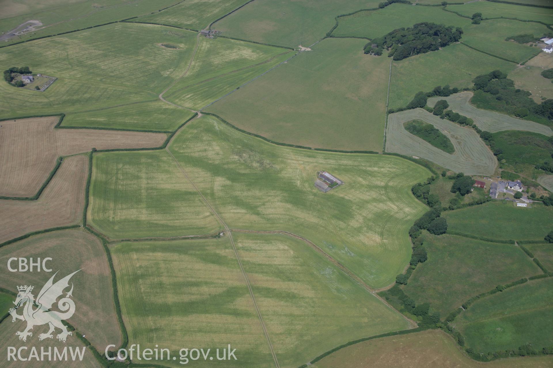 RCAHMW colour oblique aerial photograph of St. Baglan's Church Enclosure Complex. Taken on 18 July 2006 by Toby Driver.