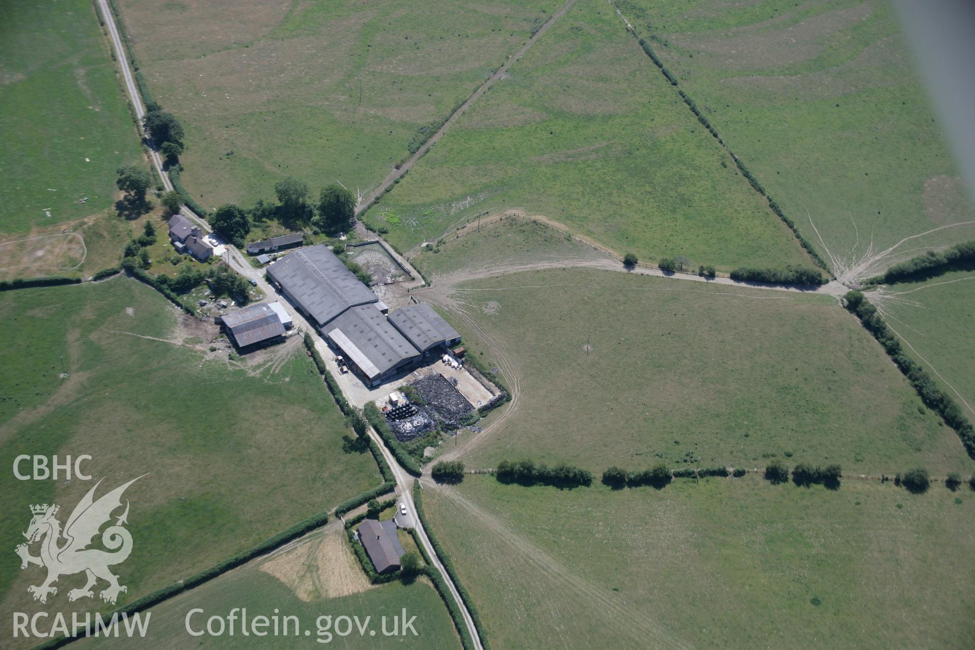 RCAHMW colour oblique aerial photograph of the rectangular enclosure and barrows at Pyllau-Isaf South. Taken on 17 July 2006 by Toby Driver.