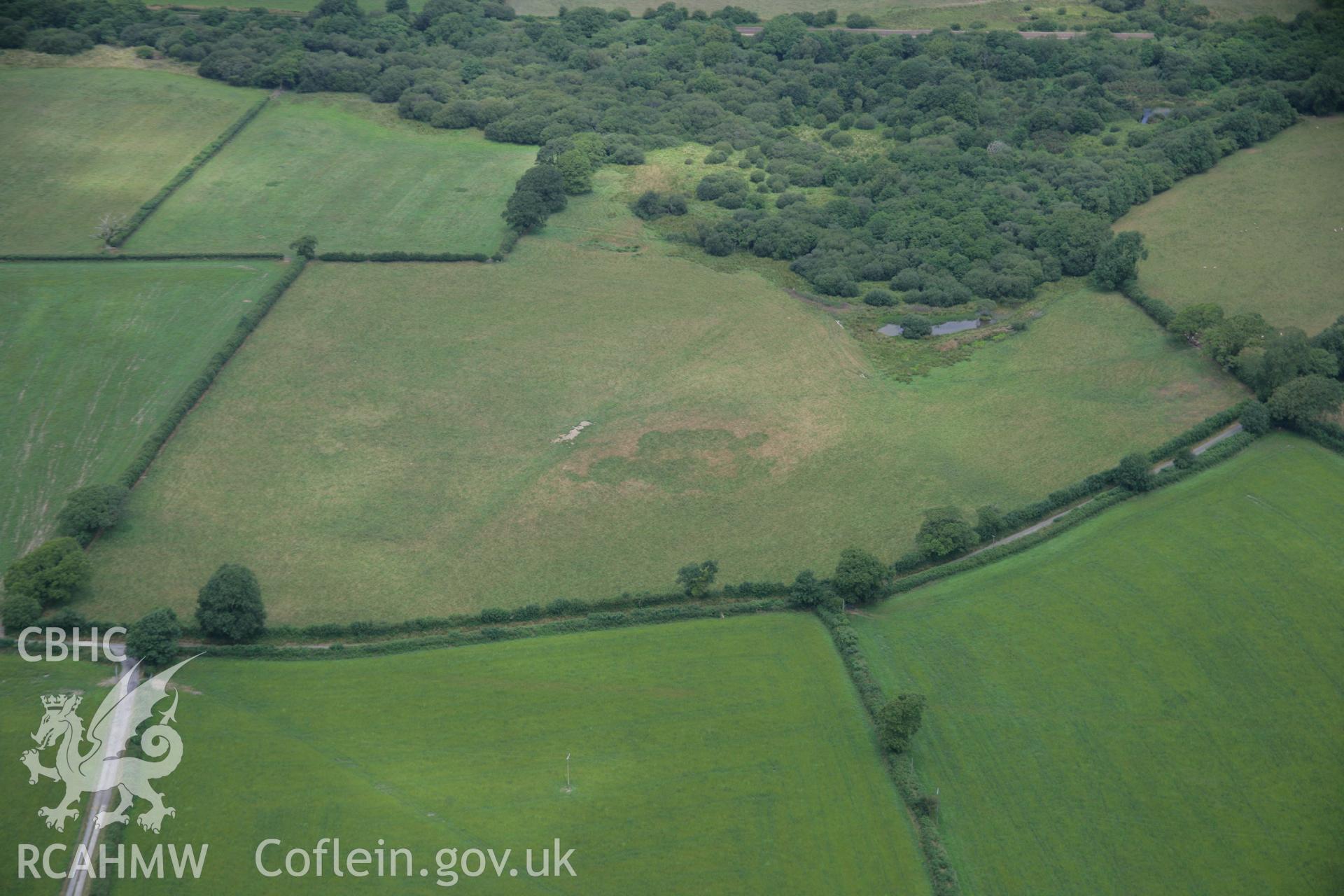 RCAHMW colour oblique aerial photograph of the Roman road west of Carmarthen at Glan-Rhyd showing the road quarries. Taken on 27 July 2006 by Toby Driver.