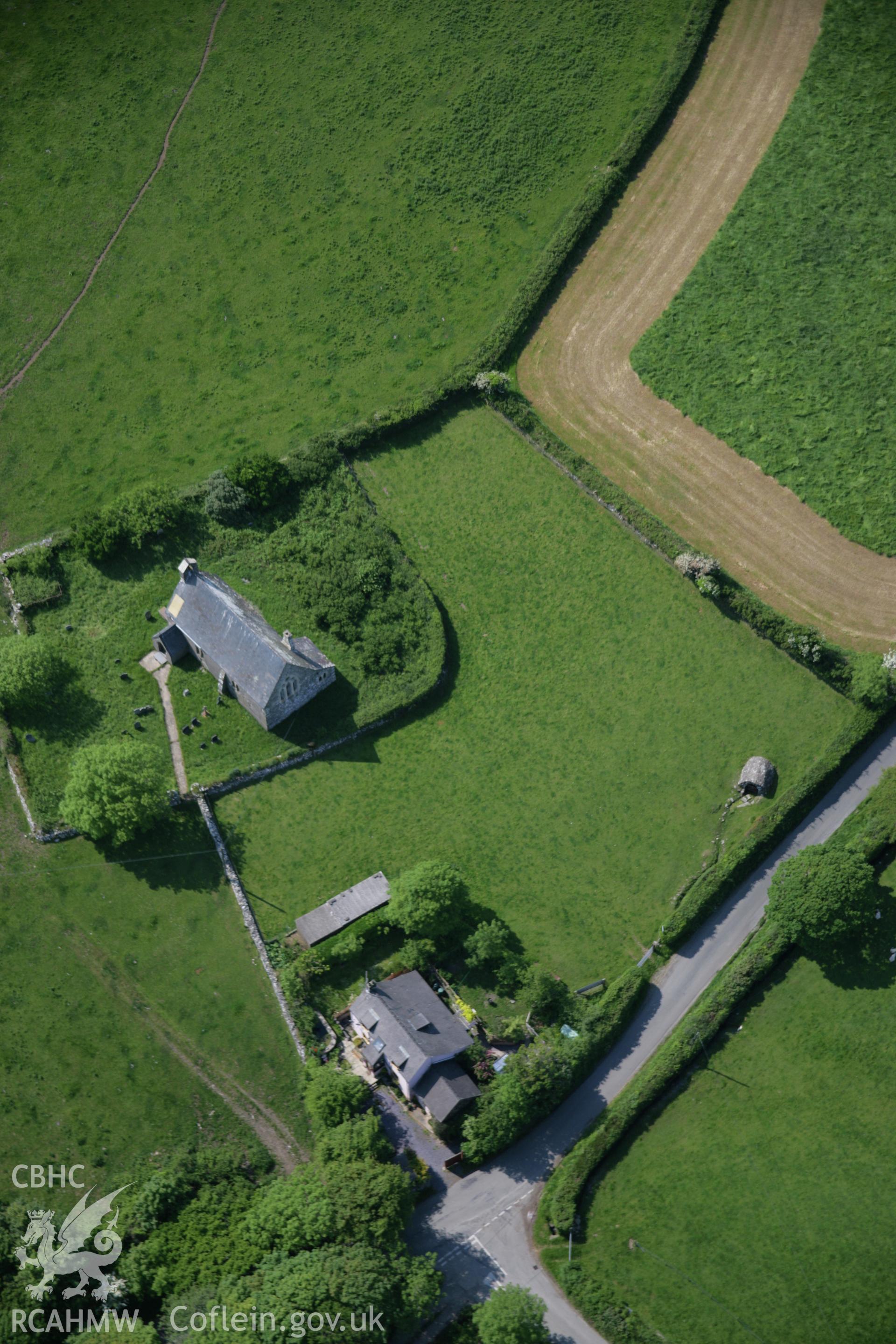 RCAHMW colour oblique aerial photograph of Holy Well and church at Llanychaer, viewed from the south. Taken on 08 June 2006 by Toby Driver.