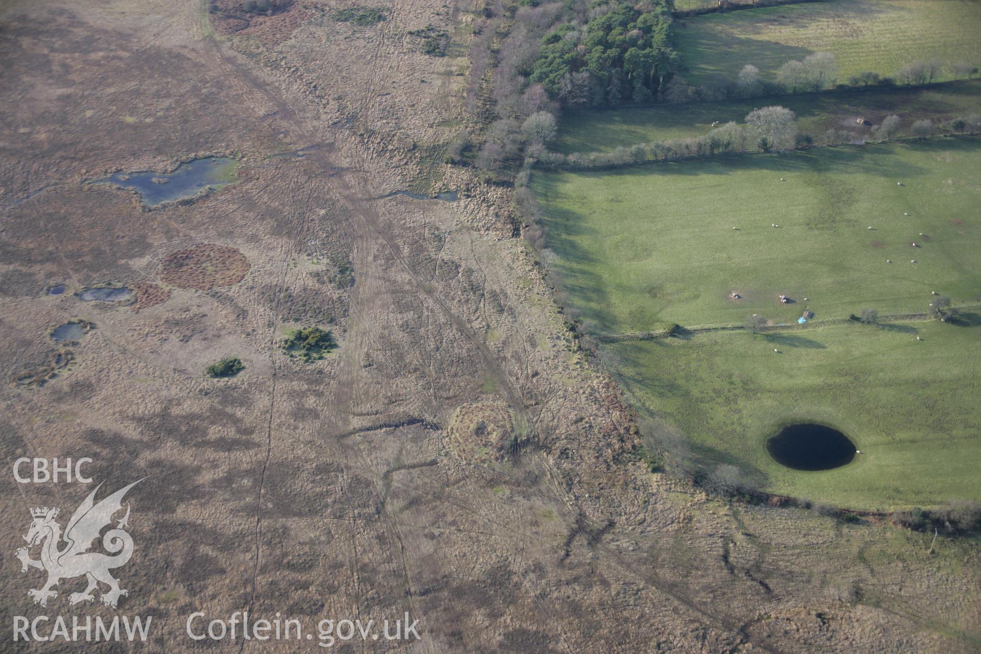 RCAHMW colour oblique aerial photograph of Pen-y-Crug Round Barrow, viewed from the north. Taken on 26 January 2006 by Toby Driver.