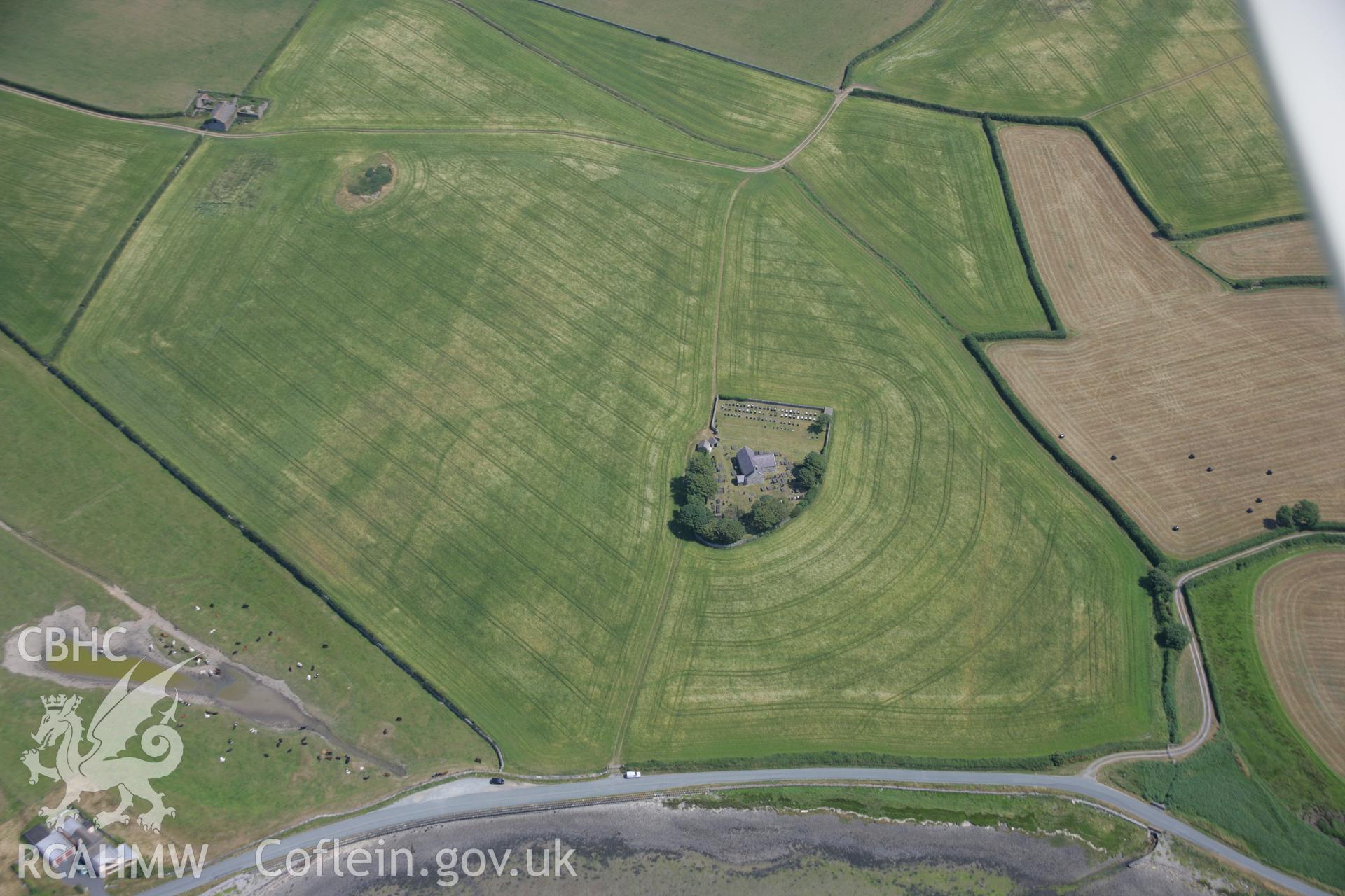 RCAHMW colour oblique aerial photograph of St. Baglan's Church Enclosure Complex. Taken on 18 July 2006 by Toby Driver.