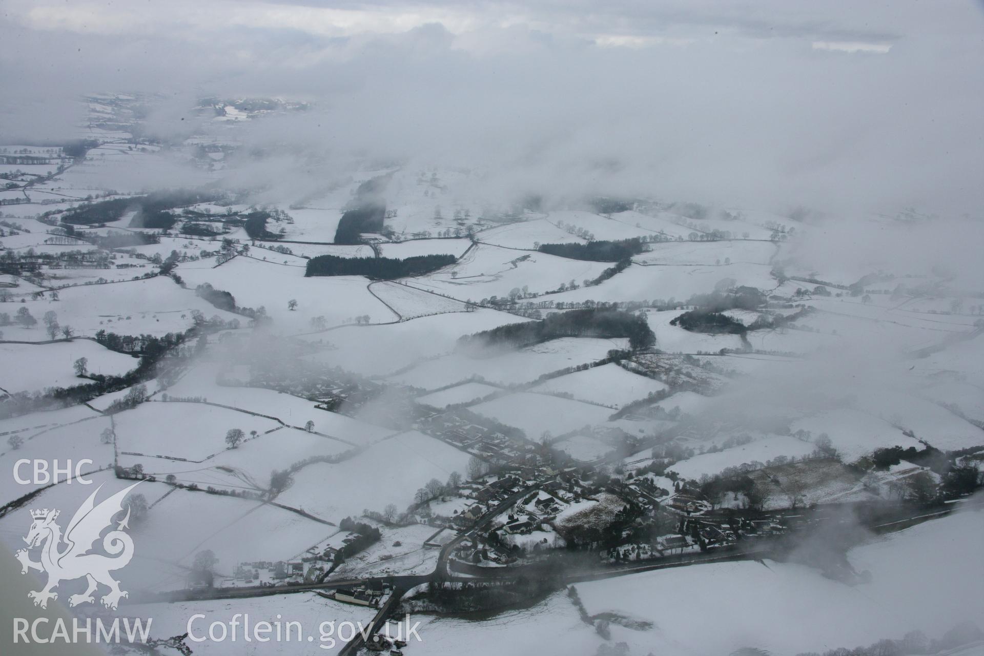 RCAHMW colour oblique aerial photograph of St Tecla's Church, Llandegla, from the south under snow. Taken on 06 March 2006 by Toby Driver.