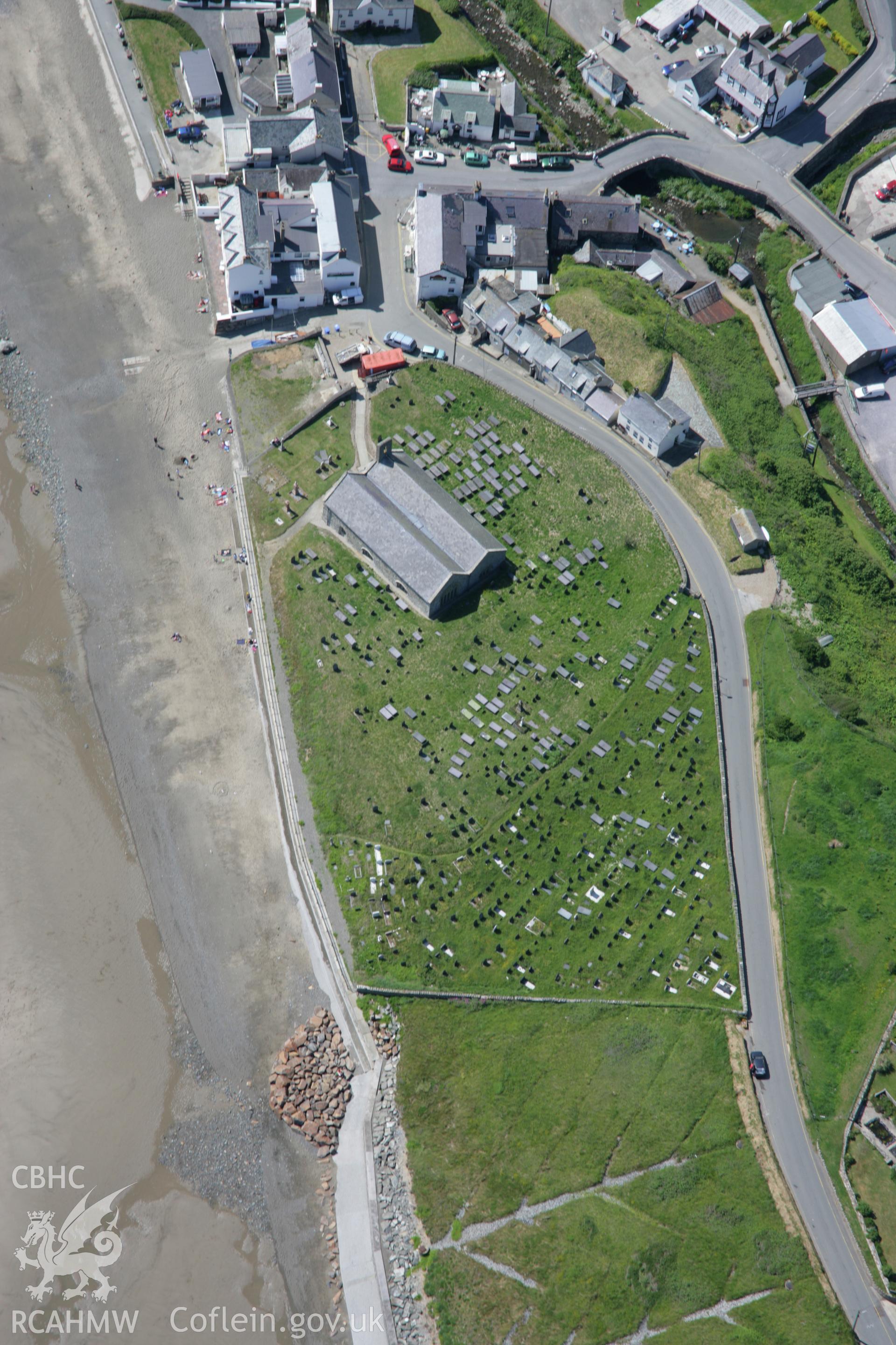 RCAHMW colour oblique aerial photograph of St Hywyns Church, Aberdaron, from the east. Taken on 14 June 2006 by Toby Driver.