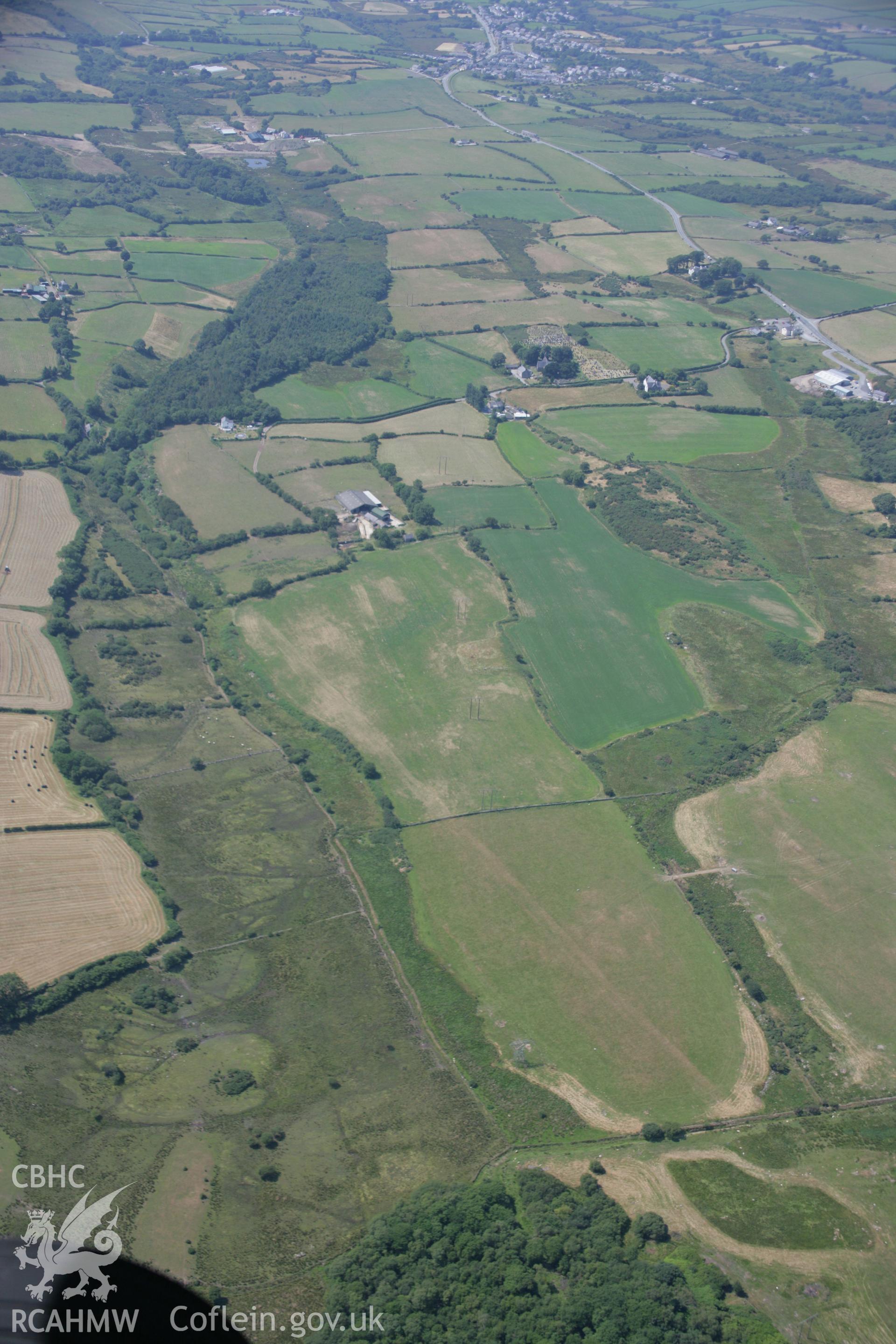 RCAHMW colour oblique aerial photograph of Ty-Mawr Burnt Mound in parched landscape at Llanddeiniolen. Taken on 18 July 2006 by Toby Driver