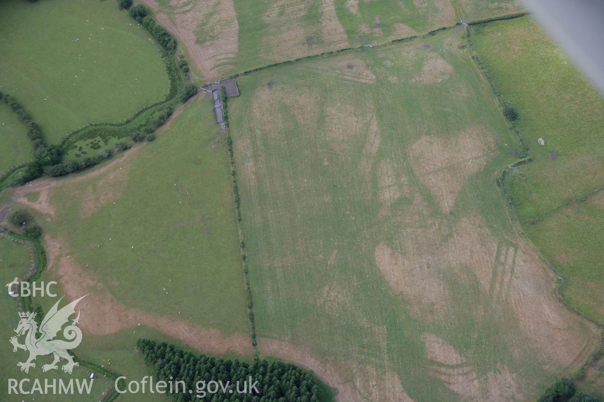 RCAHMW colour oblique aerial photograph of Llanfor Roman Military Complex visible in cropmarks, viewed from the south-east. Taken on 31 July 2006 by Toby Driver.