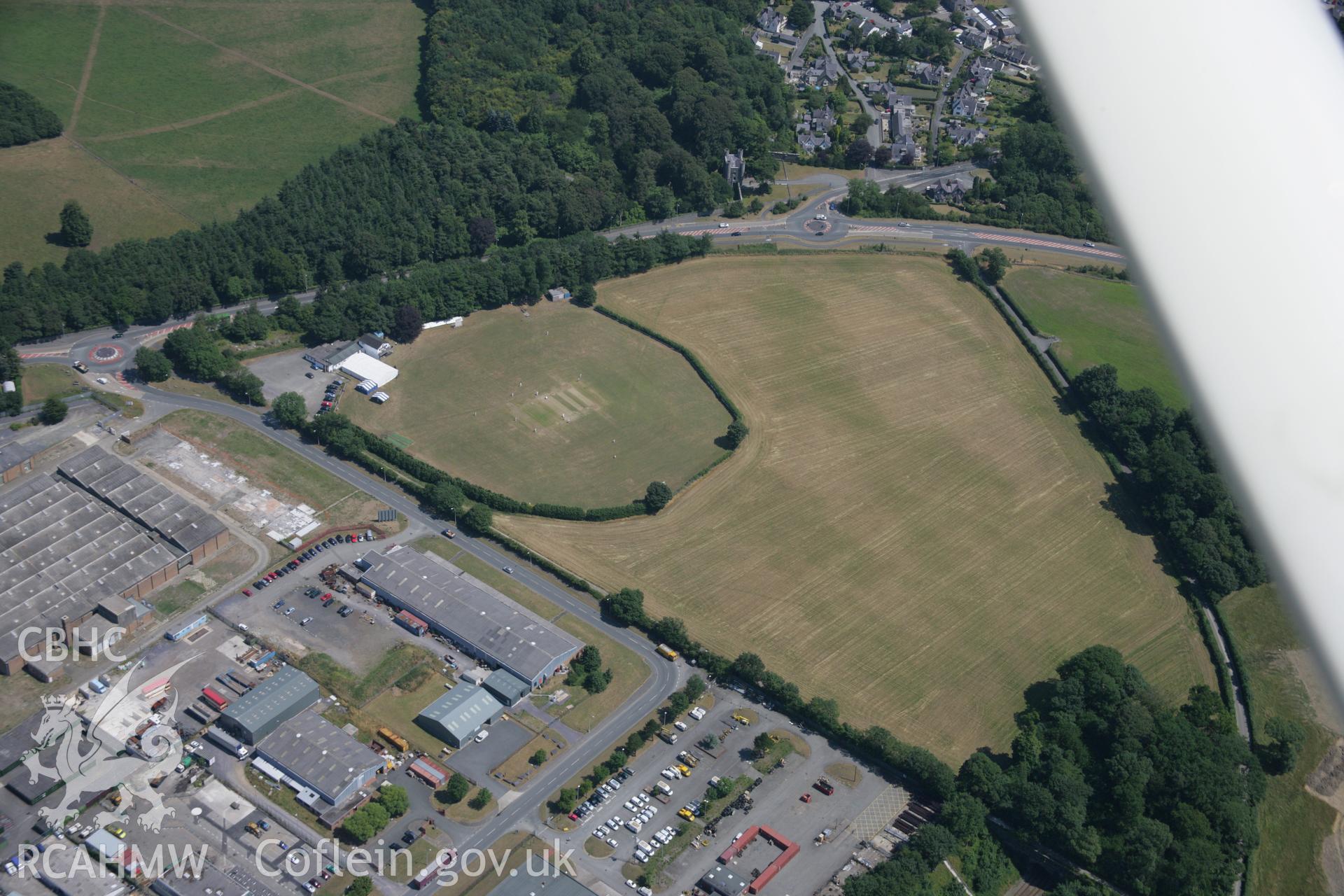 RCAHMW colour oblique aerial photograph of Llandegai Henge Monuments and Cursus. Taken on 18 July 2006 by Toby Driver.