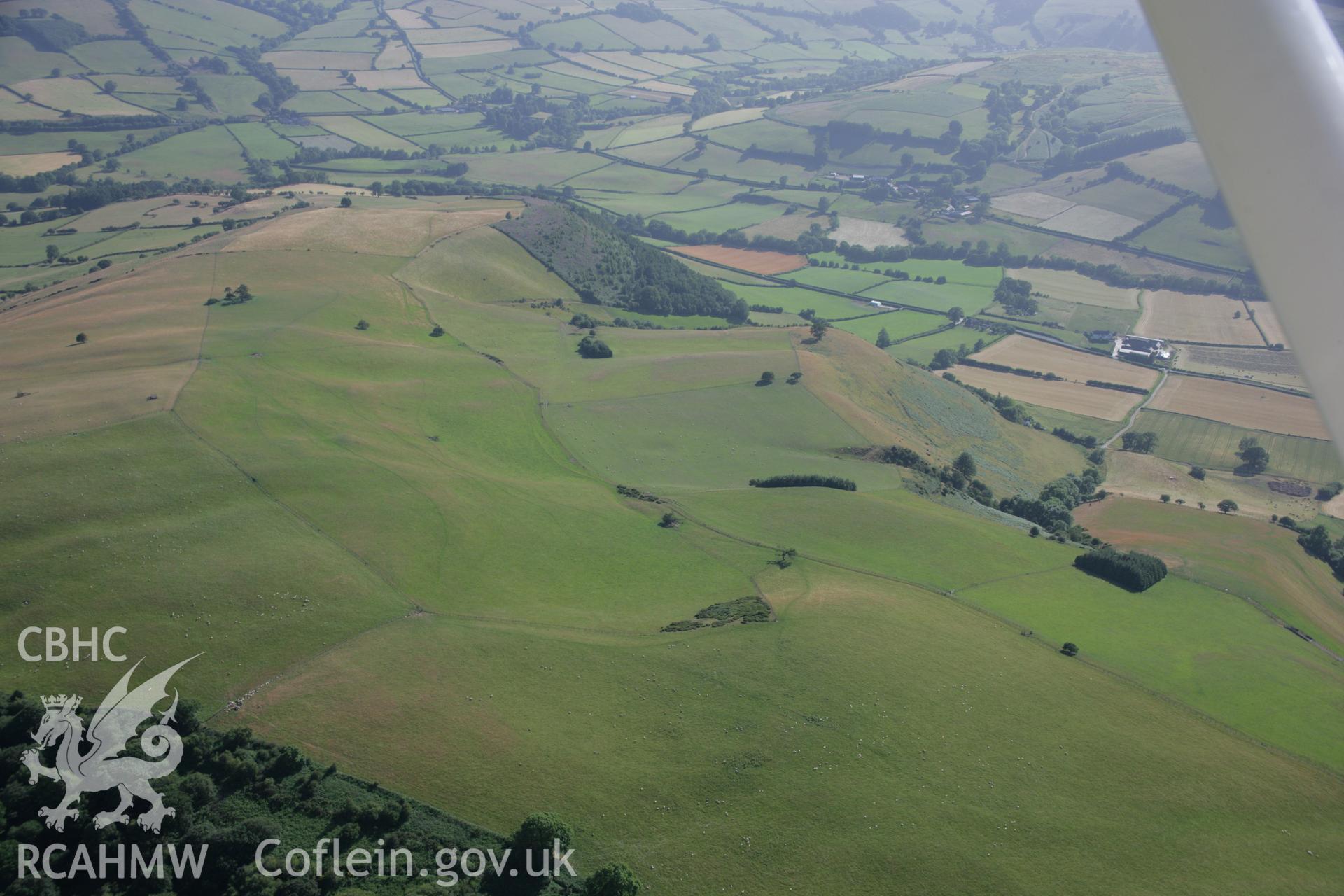 RCAHMW colour oblique aerial photograph of a section of Offa's Dyke 1125m southwest To Gilfach Wood. Taken on 13 July 2006 by Toby Driver.