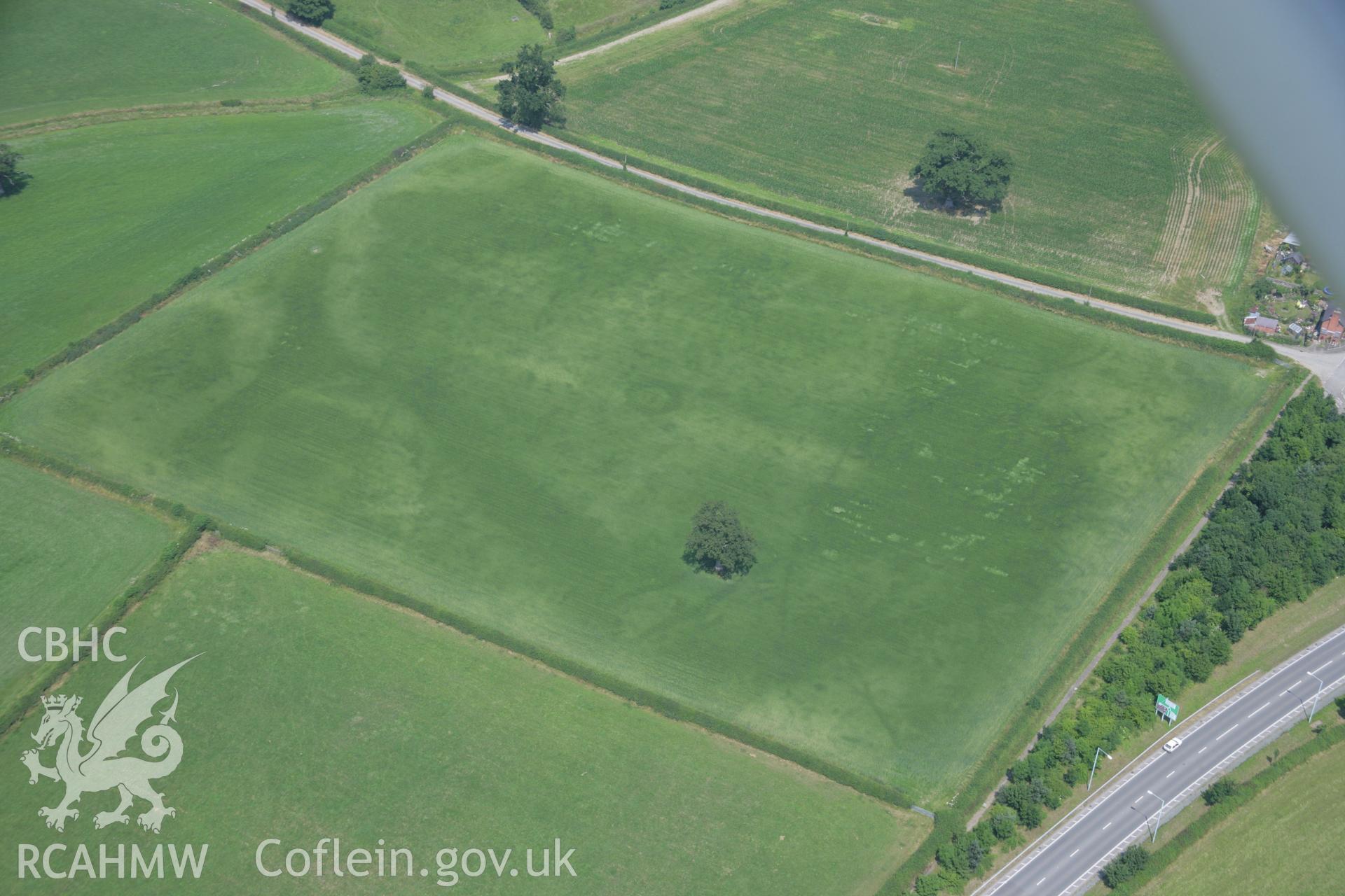 RCAHMW colour oblique aerial photograph of Sarn-y-Bryn Caled. Taken on 04 July 2006 by Toby Driver