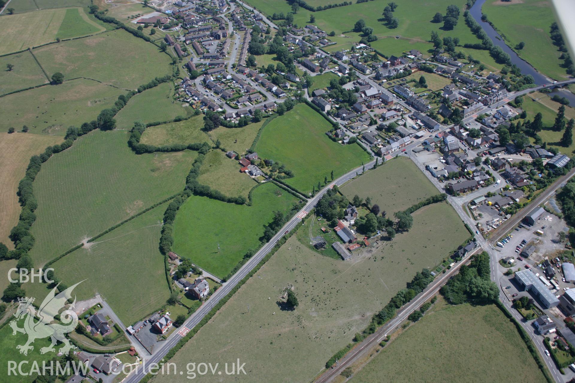 RCAHMW colour oblique aerial photograph of Caersws Roman Military Settlement. Taken on 17 July 2006 by Toby Driver.