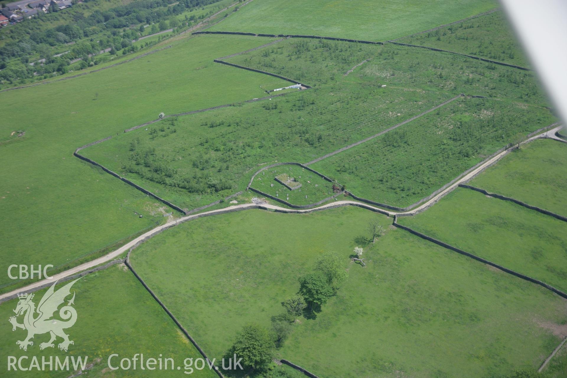 RCAHMW colour oblique aerial photograph of the site of the Tegernacus Stone from the west. Taken on 09 June 2006 by Toby Driver.