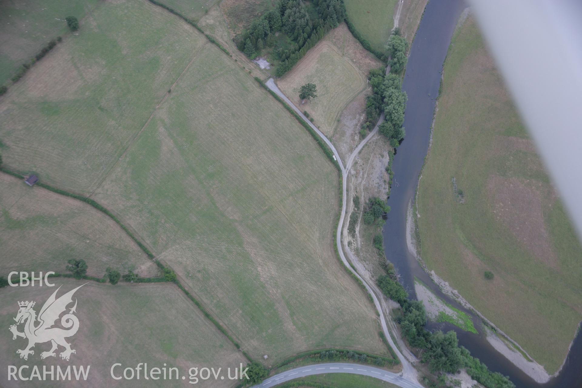 RCAHMW colour oblique aerial photograph showing parchmarks in grass at Llwyn-y-Brain Roman Fort. Taken on 14 August 2006 by Toby Driver.