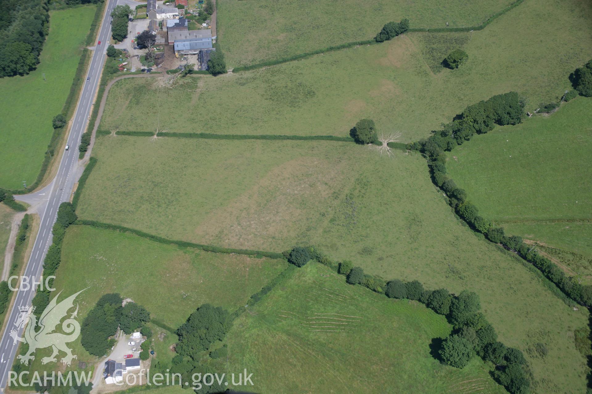 RCAHMW colour oblique aerial photograph of Odyn Fach Enclosure. Taken on 17 July 2006 by Toby Driver.