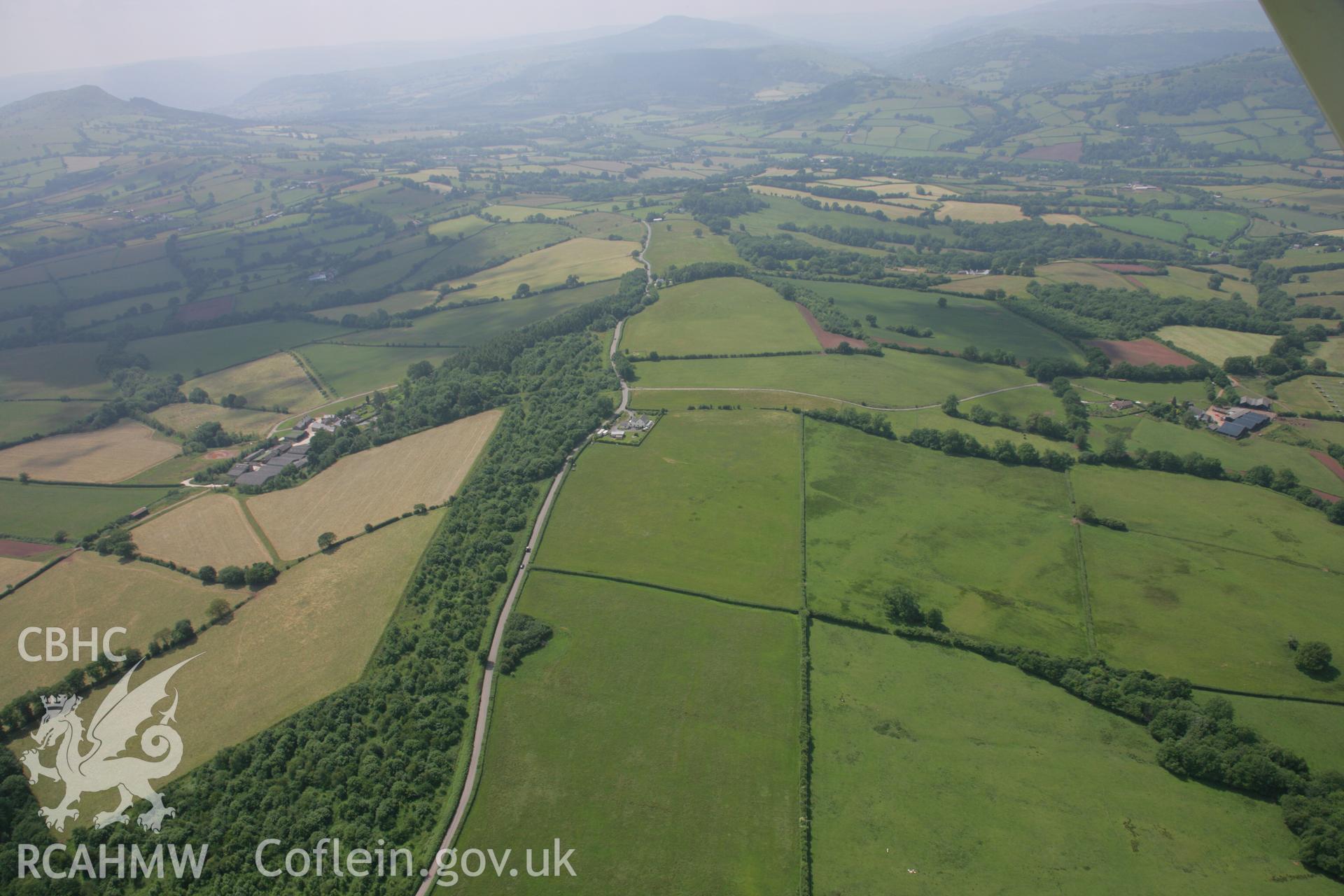 RCAHMW colour oblique photograph of Campston Hill battle site, near Llangattock Lingoed. Taken by Toby Driver on 29/06/2006.