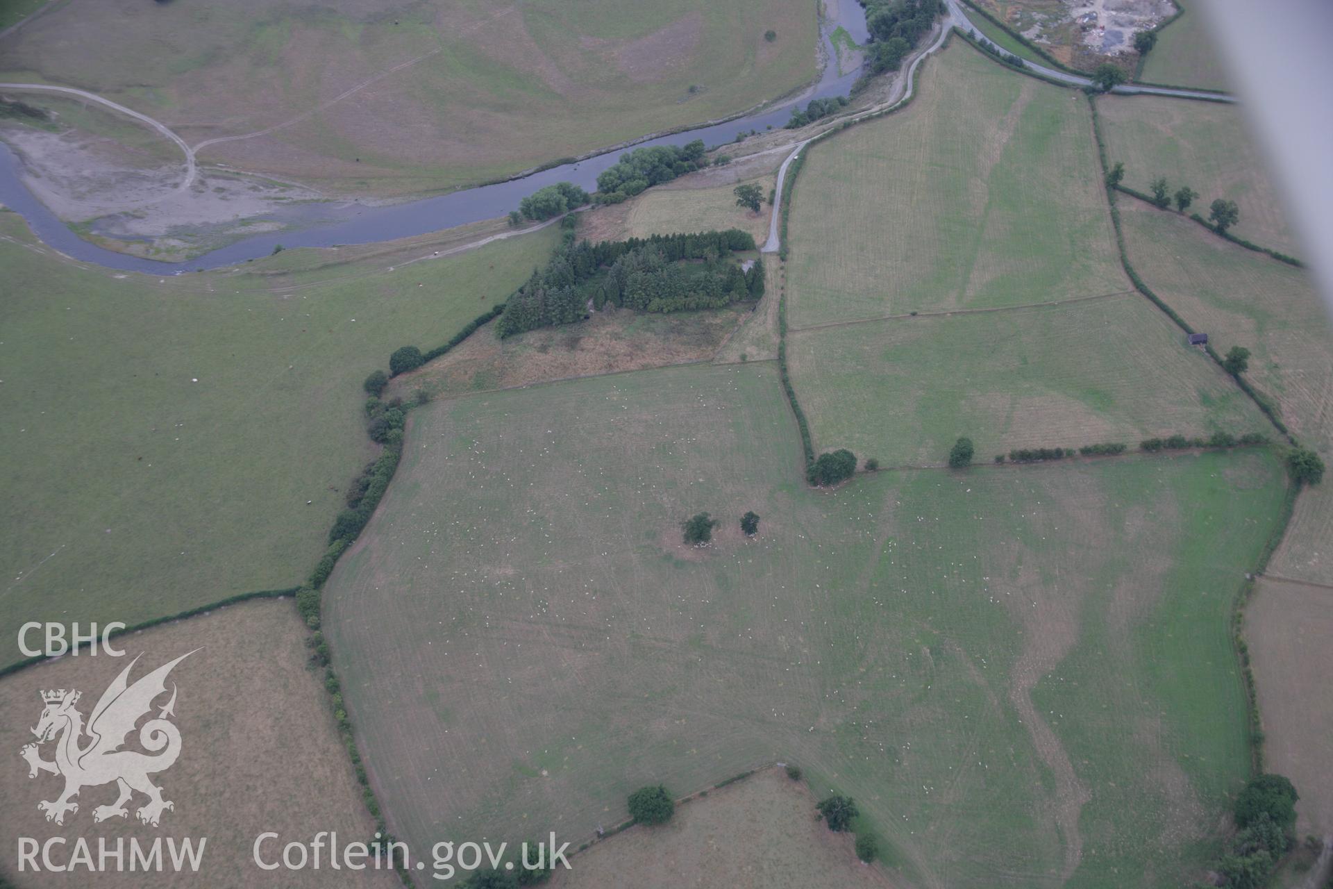 RCAHMW colour oblique aerial photograph showing parchmarks in grass at Llwyn-y-Brain Roman Fort. Taken on 14 August 2006 by Toby Driver.