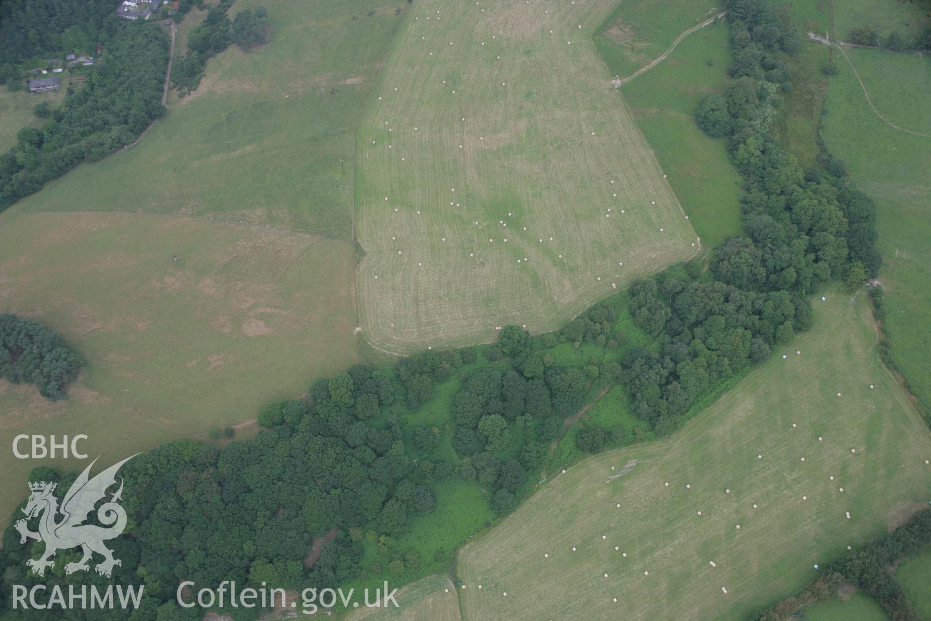 RCAHMW colour oblique aerial photograph of cropmark enclosure near Home Farm. Taken on 21 July 2006 by Toby Driver.