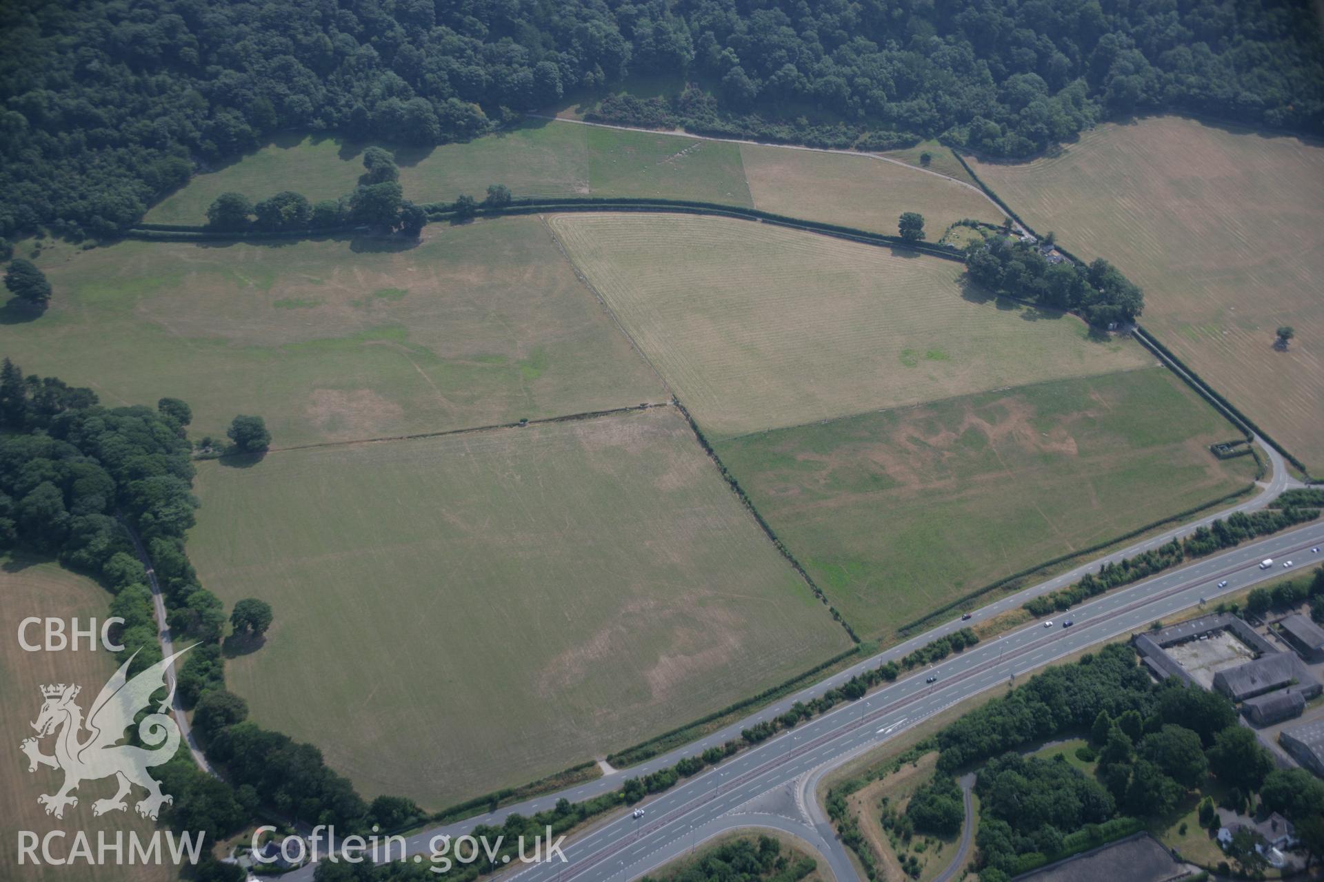 RCAHMW colour oblique aerial photograph of a section of the Caerhun to Caernarfon Roman Road Segment at Madryn. Taken on 25 July 2006 by Toby Driver.