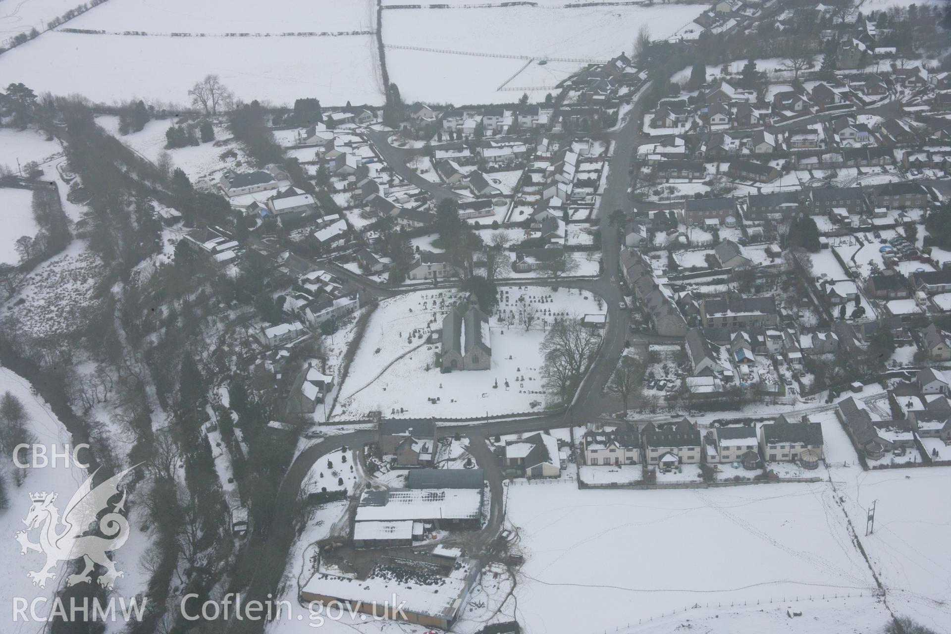 RCAHMW colour oblique aerial photograph of Llanarmon-yn-Ial, viewed from the east. Taken on 06 March 2006 by Toby Driver.