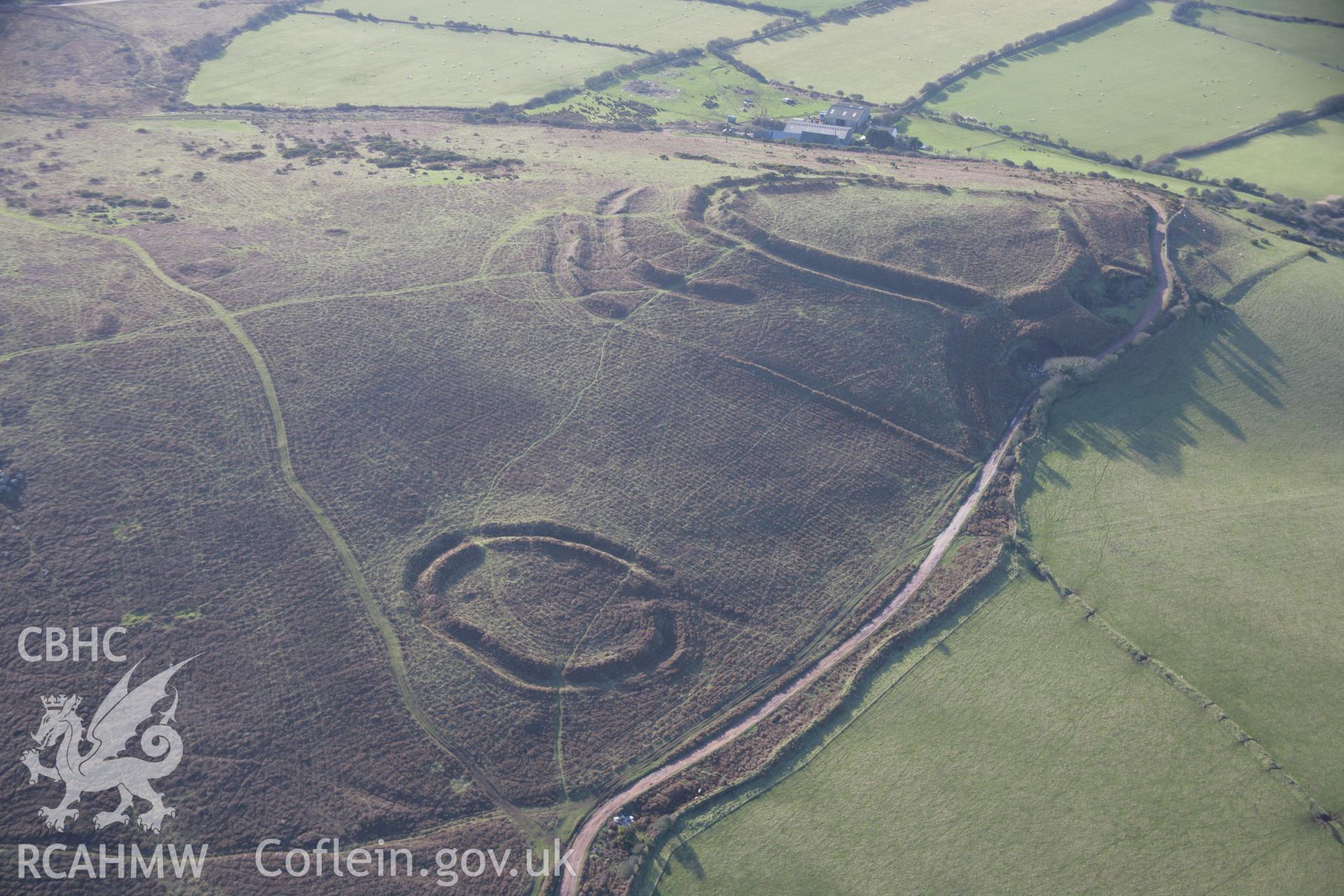 RCAHMW colour oblique aerial photograph of Hardings Down North Enclosure from the north-east with the western fort beyond. Taken on 26 January 2006 by Toby Driver.