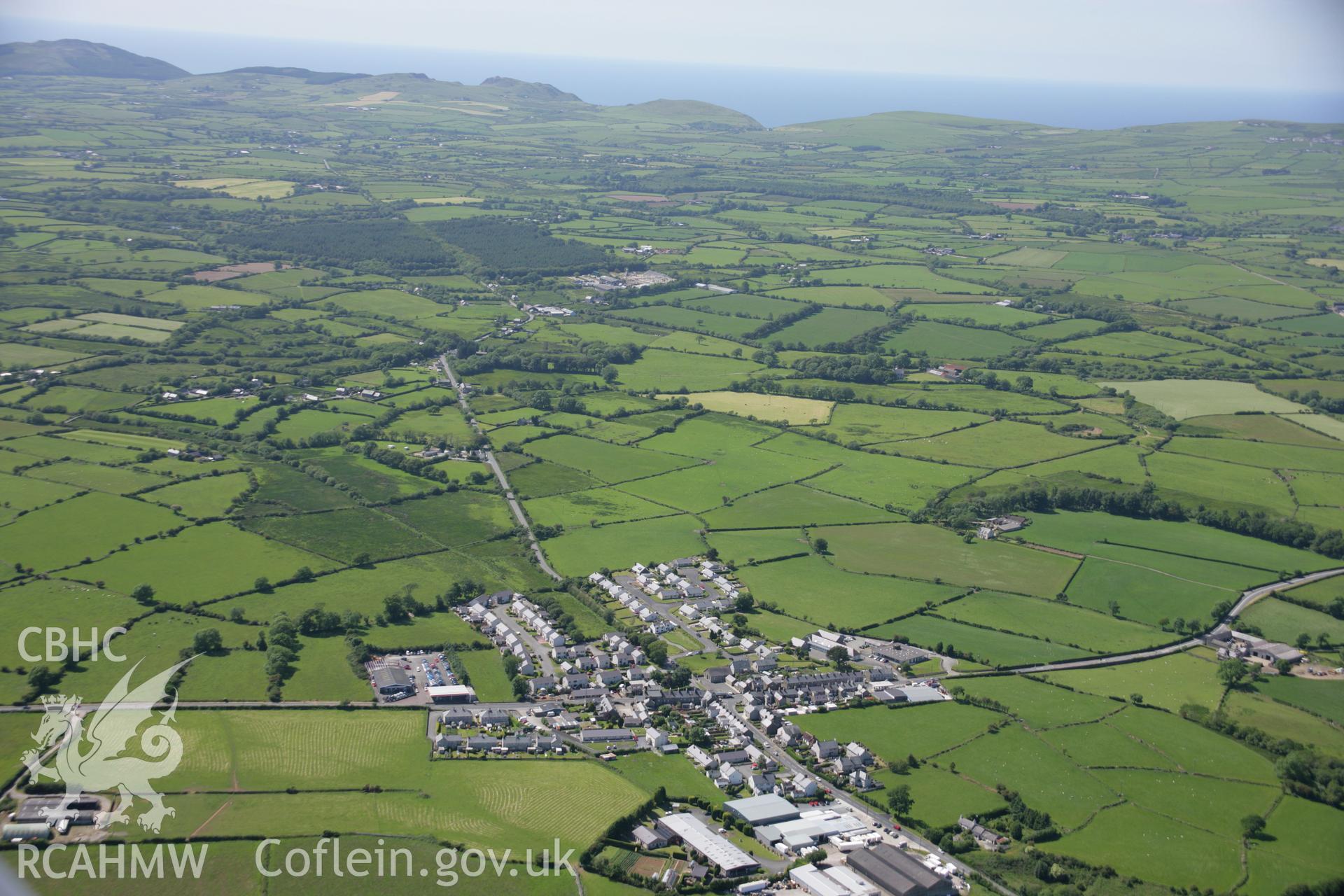 RCAHMW colour oblique aerial photograph showing landscape view of Y Ffor village, including Ebeneser and Salem chaples, viewed from east. Taken on 14 June 2006 by Toby Driver