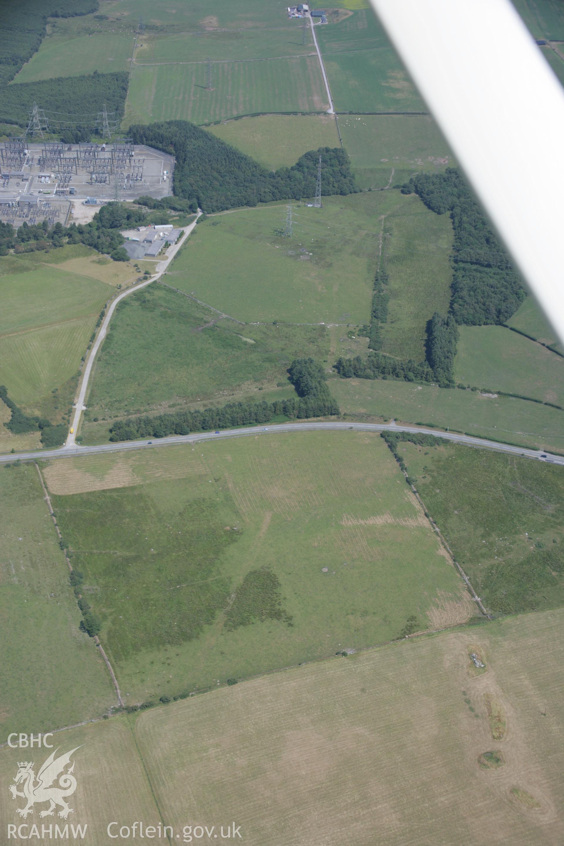 RCAHMW colour oblique aerial photograph of sections of Roman road at Ty'n-Llwyn. Taken on 18 July 2006 by Toby Driver.