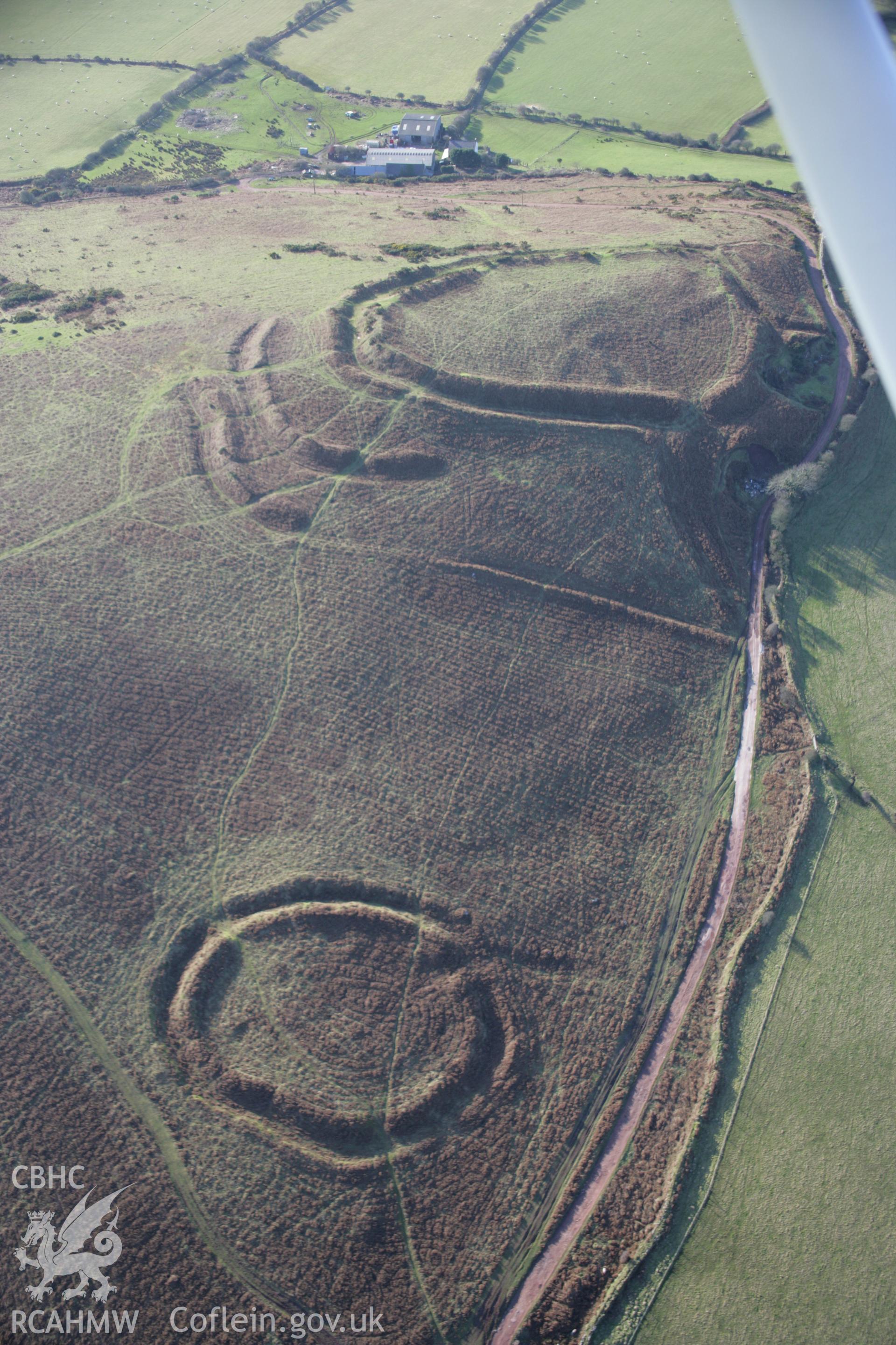 RCAHMW colour oblique aerial photograph of Hardings Down North Enclosure from the east with the western fort beyond. Taken on 26 January 2006 by Toby Driver.