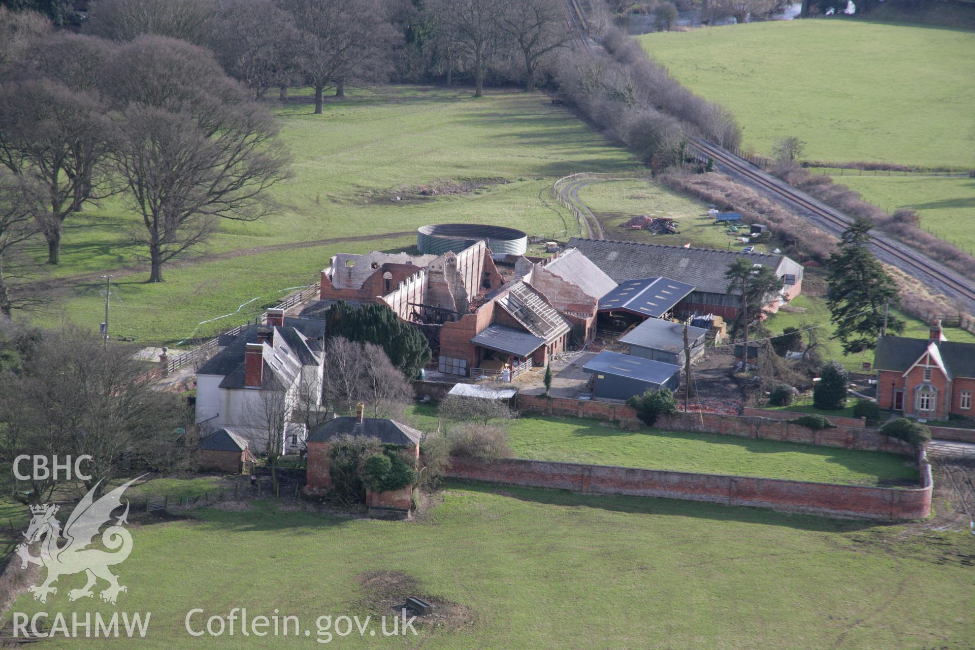 RCAHMW colour oblique aerial photograph of the demolished Glanhafren Great Barn, Leighton Estate, from the north, whilst a ruin following a fire. Taken on 06 March 2006 by Toby Driver.