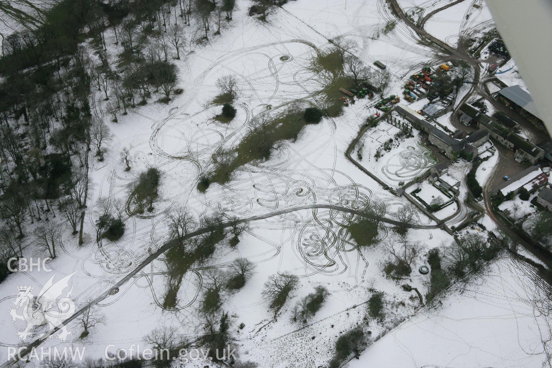 RCAHMW colour oblique aerial photograph of Old Foxhall Round Barrow and earth circle, viewed from the north-east. Taken on 06 March 2006 by Toby Driver.