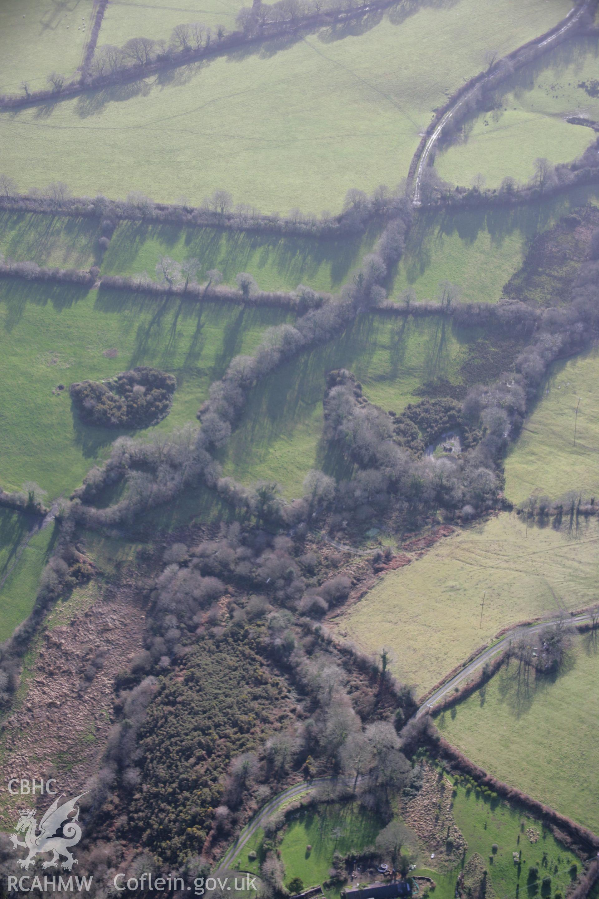 RCAHMW colour oblique aerial photograph of Thomas Chapel Colliery, and the nearby railway embankment, from the north-west. Taken on 11 January 2006 by Toby Driver