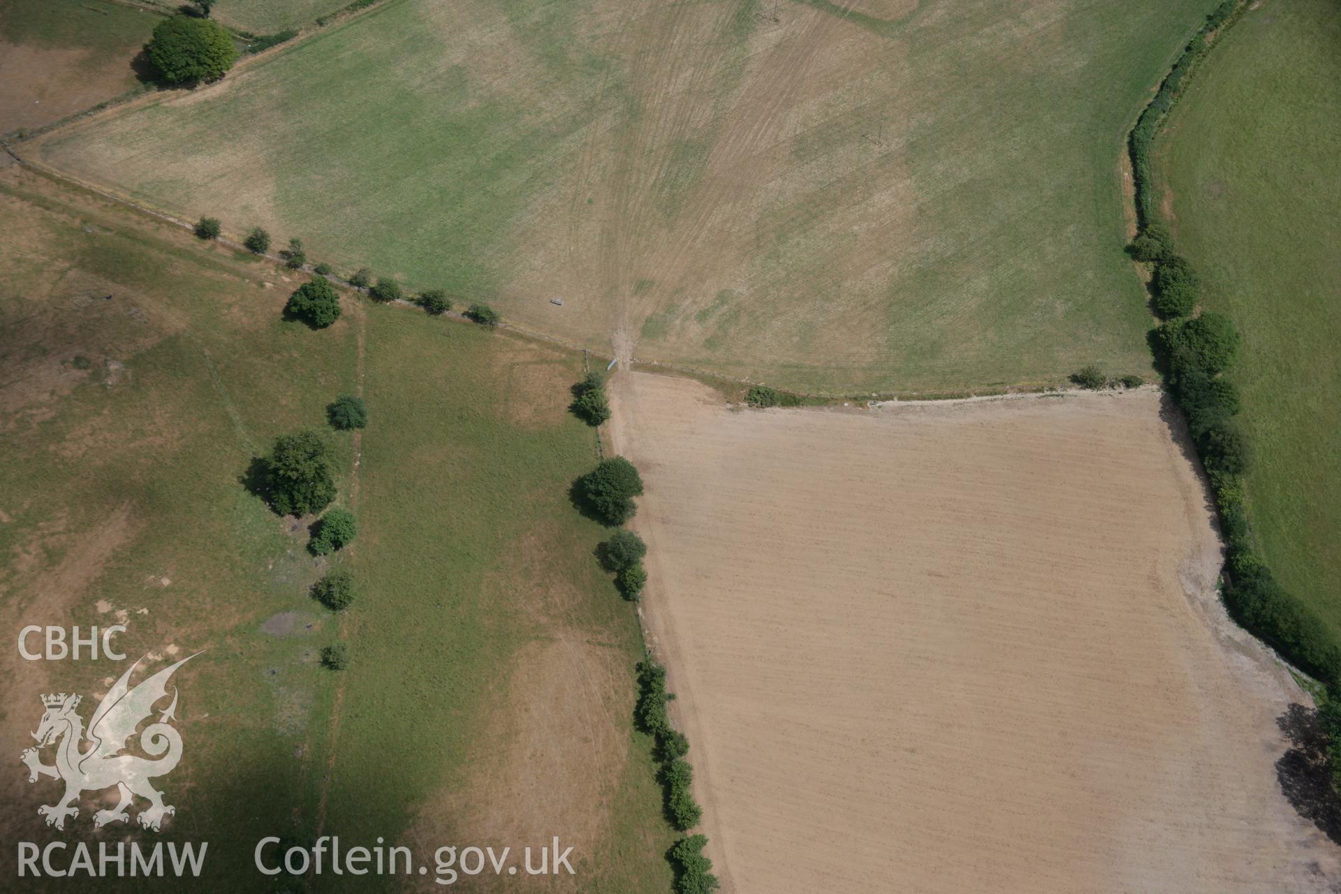 RCAHMW colour oblique aerial photograph of a bivallate enclosure west of Caerau, possibly representing a villa enclosure. Taken on 27 July 2006 by Toby Driver.